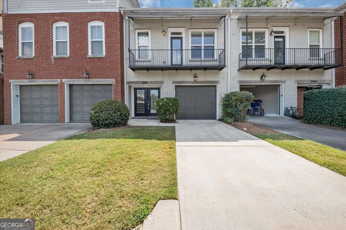 Welcome to this beautifully maintained 2-bedroom, 2.5-bathroom townhome in the gated Brookside Green community offers comfort, convenience, and low-maintenance living. The open-concept main level features a spacious family room with a fireplace, seamlessly flowing into the dining/breakfast area and kitchen, with the view of the spacious fenced-in backyard, perfect for entertaining or everyday living. The kitchen boasts granite countertops, stainless steel appliances, abundant cabinetry, and a breakfast bar. A convenient half bath on the main level. Upstairs, you'll find two large bedrooms, each with its own private full bathroom. The owner's suite includes a walk-in closet and spa-like bathroom with dual vanities, a soaking tub, and a separate tiled shower. The secondary bedroom is equally spacious, ideal for family, guests, or a home office. The home comes with a washer and dryer included. Recent upgrades include new interior paint and new carpet, giving the home a bright, updated feel making it truly move-in ready. This home includes a new water heater installed in 2024 and new HVAC unit that installed in 2023. Additional highlights include hardwood floors on the main, a private fenced courtyard patio, a secure 1-car garage and a driveway for an additional vehicle. The gated community provides access to a swimming pool and HOA-maintained landscaping, allowing for a stress-free, lock-and-leave lifestyle. Conveniently located just minutes from I-85, shopping, dining, and top-rated schools, this home offers the perfect balance of suburban comfort and city convenience. Qualifying buyers may benefit from 100% financing and up to 5% down payment assistance funds when using our preferred lender. Don't miss this exceptional opportunity-schedule your private showing today!