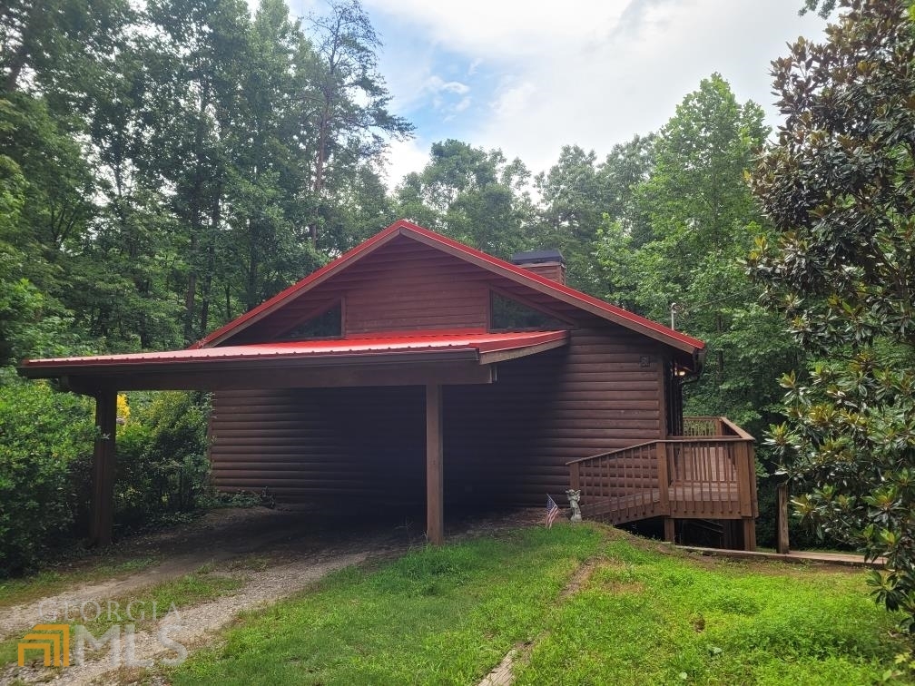 Are you looking for a North Georgia Cabin to recharge but that's still close to shopping, dining, and outdoor attractions? Then this Helen home or vacation rental is the perfect place for you! This charming 3 bedroom, 3 bath cabin boasts hardwood floors, gas fireplace, and a full finished basement. It offers a spacious open living room with plenty of windows to let in the natural light. The kitchen is well equipped to prepare meals for the family. 2 cozy bedrooms and 2 full baths are on the main floor to provide rest and relaxation after a long day. The full finished basement offers a second living area/game room, a kitchenette, a full bedroom and bathroom that is perfect as in law suite or extra room for your guests. The large rocking chair back porch will prove to be a popular spot to entertain family and friends or just breathe in the crisp mountain air. And I know the hot tub will be a favorite among all ages! It is nestled on 0.5 acres in sought after Helen GA.It is convenient to downtown Helen, local wineries, hiking trails, waterfalls and festivals...this woodland abode has everything you need for a memorable Peach State Vacay home. It is currently used as a short term rental property that is managed by Georgia Mountain Rentals. This is a rate opportunity to own a income producing property in the Heart of Helen. Don't delay!! Schedule your tour today.