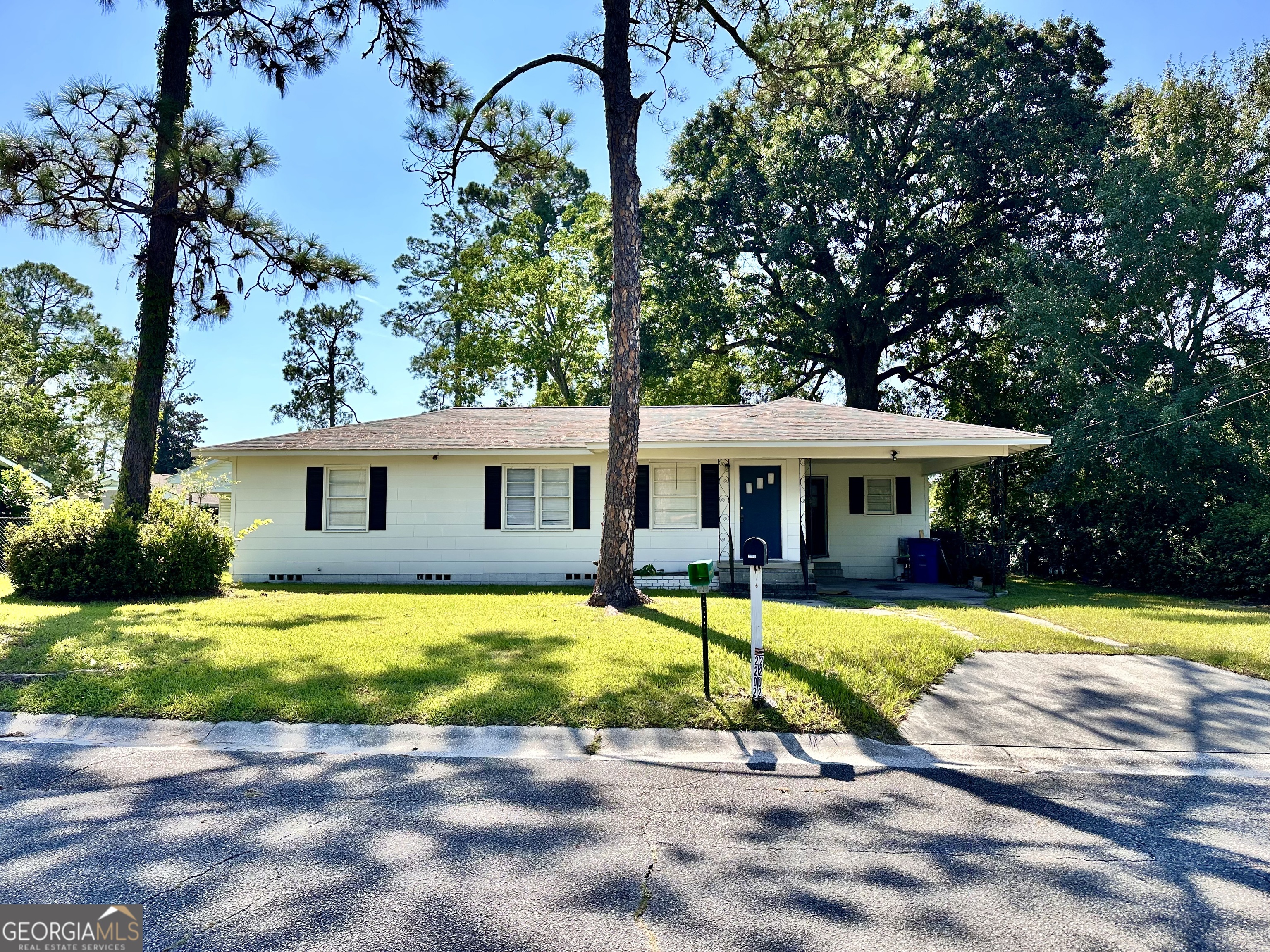 Picture yourself coming home to this beautifully updated 3-bedroom, 2-bath home, full of charm and comfort in Waycross. Imagine starting your day in the bright kitchen, with plenty of cabinet space to keep everything within reach, while the open flow to the living room makes mornings and evenings feel connected and easy. Down the hall, three inviting bedrooms and a full bath provide the perfect retreat-quiet, private, and cozy. A second bathroom leads into a large, versatile space with a laundry area, ideal for keeping your household organized while still leaving plenty of room for a hobby corner, playroom, or home office. Step outside to enjoy peaceful afternoons in your fenced backyard-whether it's pets playing, kids running, or friends gathering for a cookout. The attached carport makes everyday living simple with covered parking and extra storage. Conveniently located close to the hospital and other everyday essentials, this home is both practical and inviting. With fresh updates and thoughtful features throughout, it's ready to welcome you into a lifestyle of comfort and ease. Come see how quickly you'll fall in love with your new home in Waycross.