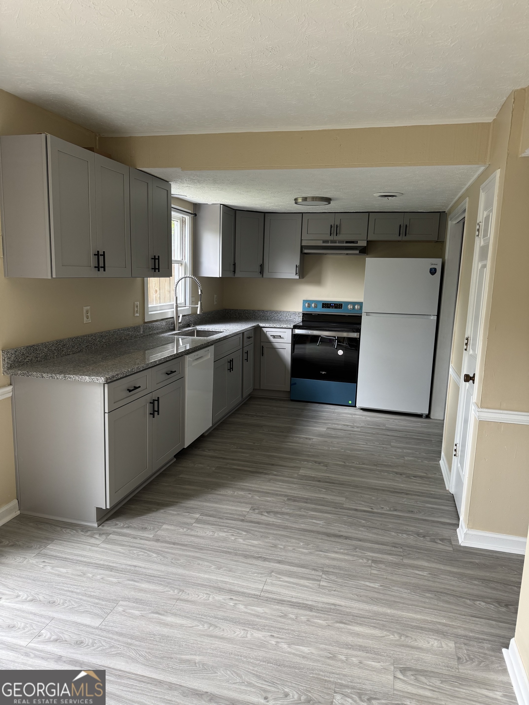 The Space:This spacious townhome has been fully renovated and is move-in ready. Enjoy brand new LVP flooring, fresh paint throughout, and modern updates. The first floor features a generous living area and a newly remodeled kitchen with all-new cabinets, granite countertops, and updated appliances. Upstairs, you'll find two large bedrooms and a full bathroom with new vanities. The Location:Ideally situated on the UGA bus route and in the heart of Five Points, this townhome offers easy access to shopping, dining, the state park, football games, and more - everything Athens has to offer is just minutes away. Requirements:Credit score of 680+ required to apply.