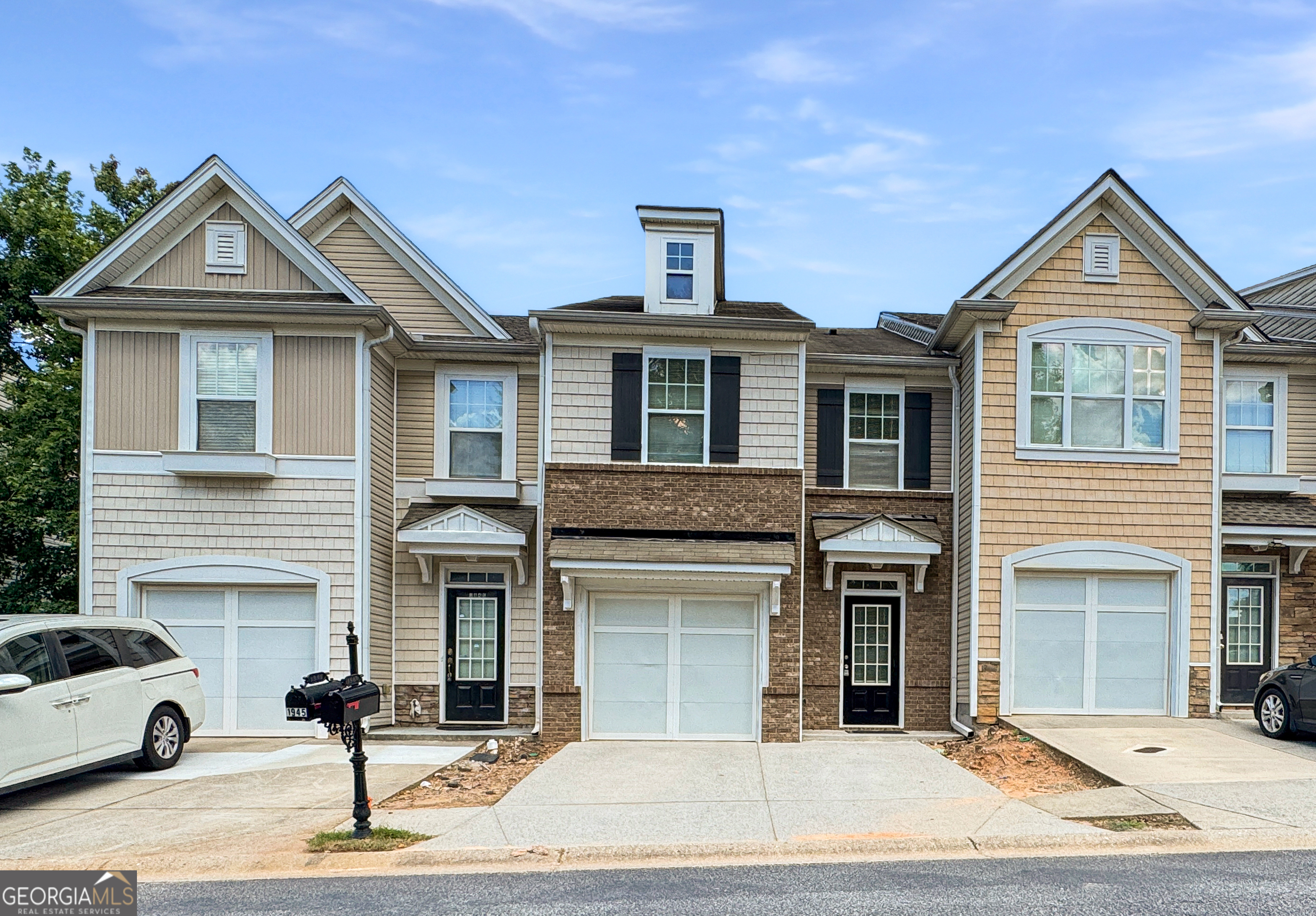 Move-In Ready Townhome in Prime Location! Freshly updated with new interior paint, new LVP flooring in the foyer, kitchen, laundry & all 3 bathrooms. this spacious townhome is located just minutes from I-85, shopping, and top dining spots. The roommate-style floor plan offers two oversized bedrooms, including a secondary bedroom with a bonus sitting area-perfect for a home office or lounge space. Enjoy an open-concept layout where the kitchen flows seamlessly into the spacious family room and dining area, ideal for entertaining or relaxing at home. The unit comes fully equipped with a refrigerator, washer, and dryer for your convenience. Situated directly across from the clubhouse, resort-style swimming pool, and playground, you'll love having these amenities just steps away.