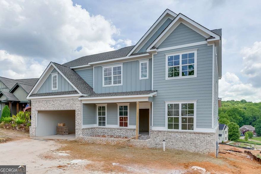 "LOT 109Q/JACKSON PLAN" Another impressive home in Traditions of Braselton by Hillgrove Homes! This floorplan boasts 5 bedrooms, 4 full baths and has all the designer touches. The spacious Gourmet Kitchen w/ oversized island overlooks the inviting Family Room. Coffered ceilings, shiplap, brick fireplace, cedar mantle and built-in cabinetry complete this space. The Kitchen features custom painted cabinetry w/ soft-close drawers, quartz or granite countertops, stainless steel appliances, tile backsplash, farm sink and spacious walk-in pantry. A Dining/Office/Flex Space and Study right off the Foyer boasts an extensive trim package. The oversized Primary Suite & Primary Bath add SO much space to this home and are complete with an oversized super shower and soaking tub, upgraded cabinetry and countertops, dual sinks and upgraded tile. Large secondary bedrooms (one full bed/bath on main level), closets & bathrooms are an extra perk. The covered back porch w/ fireplace is perfect for entertaining or back porch sitting! GOLF CART GARAGE! Sought-after Jackson County School System. Traditions of Braselton awards you swim/tennis/golf/restaurant/clubhouse/fitness facility and more. Endless activities for the amenity reach community seeker.