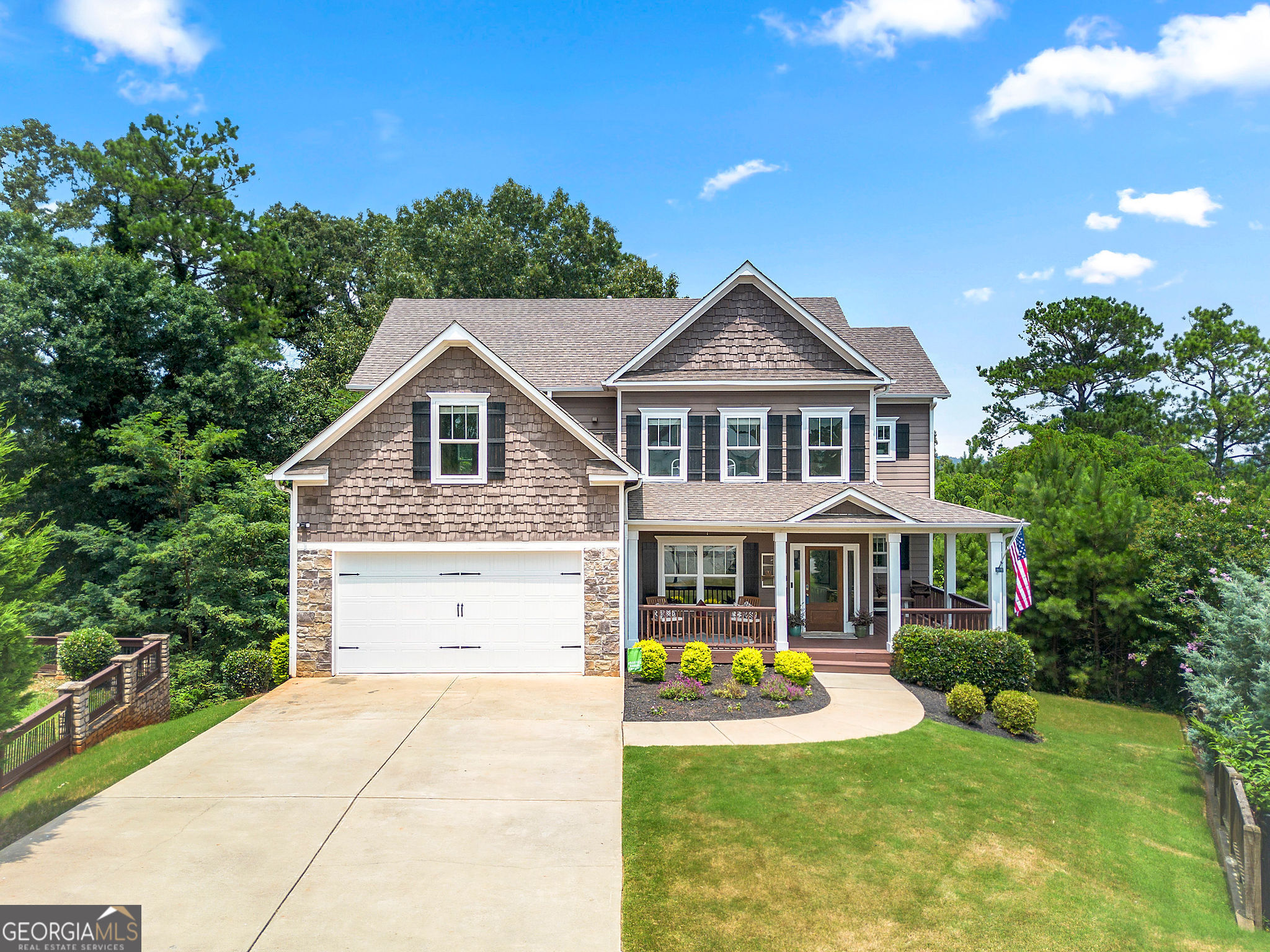Welcome home! Flawlessly crafted and thoughtfully designed, this 4-bedroom 3 bath with office/flex space and unfinished basement home sits tucked at the end of a quiet cul de sac on nearly half an acre in the heart of Cartersville. Built in 2018, a grand two-story foyer layered in elegant details welcomes you into the home, leading effortlessly into expansive living spaces centered around the graceful living room fireplace. Gleaming hardwood floors and coffered ceilings add richness and character throughout the main level. The kitchen, both functional and stylish, features stainless steel appliances, high end granite counter tops, and a central island with a cozy breakfast nook, all flow into the open concept family room. Perfect for gathering or quiet moments, the screened in back patio overlooks a lush tree lined backyard, creating a peaceful backdrop for indoor outdoor living. A flexible and intuitive layout includes a main level guest bedroom with full bath, ideal for visitors, aging in place, or a private home office. Upstairs, the primary suite offers a quiet retreat with tray ceilings, spa inspired bath with double vanity and walk in shower, a sitting area, and a generous walk-in closet. Two additional upstairs bedrooms and a spacious media room or flex office adds extra versatility to the second floor. An unfinished daylight basement offers endless potential for customization whether for recreation, additional living space, or storage. Located within the Cartersville School district, this home combines elegant design, smart functionality, and room to grow all nestled in a peaceful, well-established neighborhood minutes from Cartersville Primary. Don't miss out on this home! Schedule a private showing today!