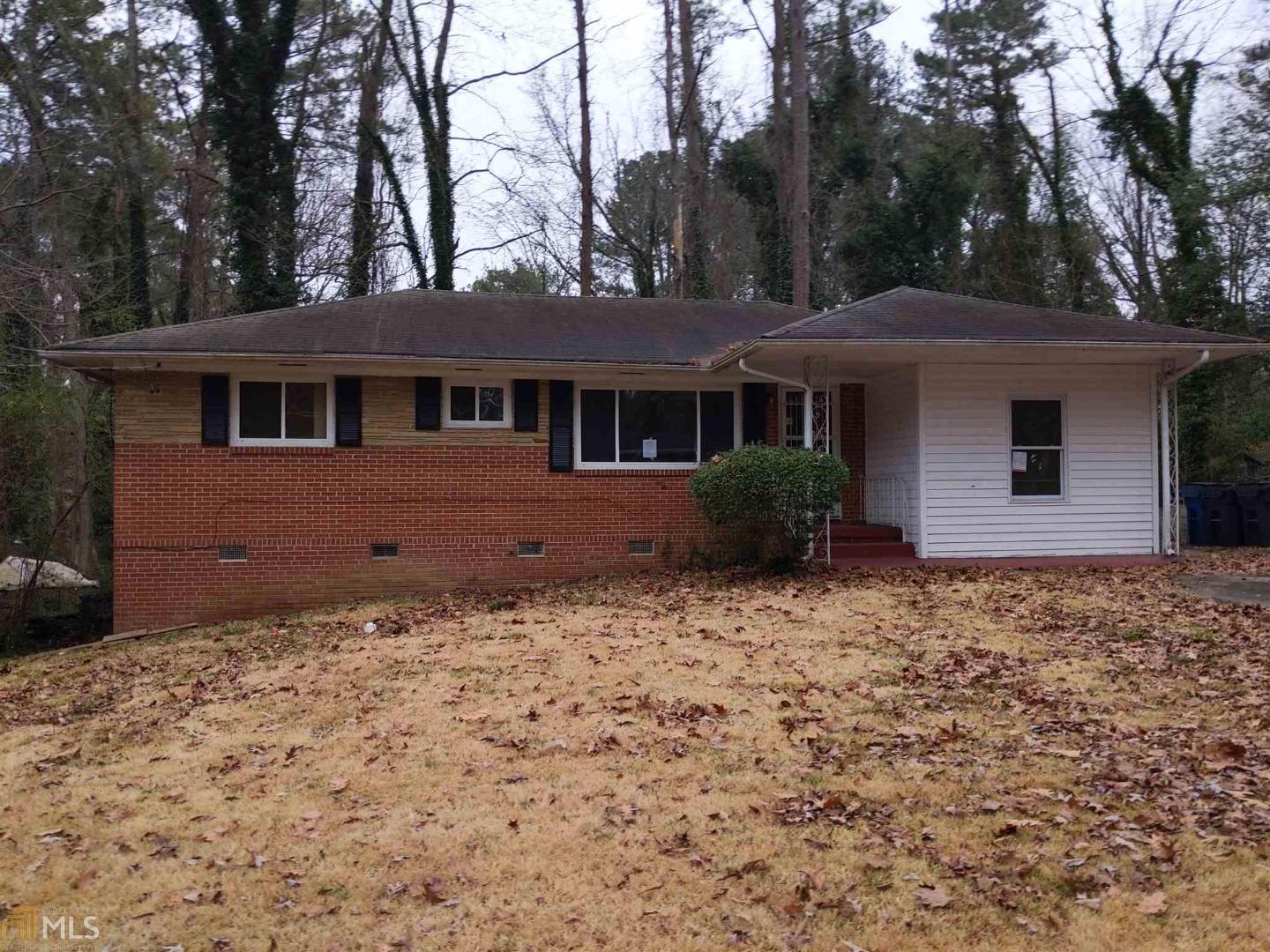 Great opportunity for investors or owner occupants looking to do some improvements with a renovation loan. The home features a separate LR, DR and FR. Original hardwoods throughout. The carport was enclosed, but would make the perfect master suite, making this home into a 3BR/2BA home. Eat-in-kitchen with white cabinets with lots of counter space & storage. Large, level backyard with mature trees and landscape. Located within minutes from Greenbriar, I-20, I-285, Downtown & the Airport. Located on the MARTA bus line for those looking to commute to work.