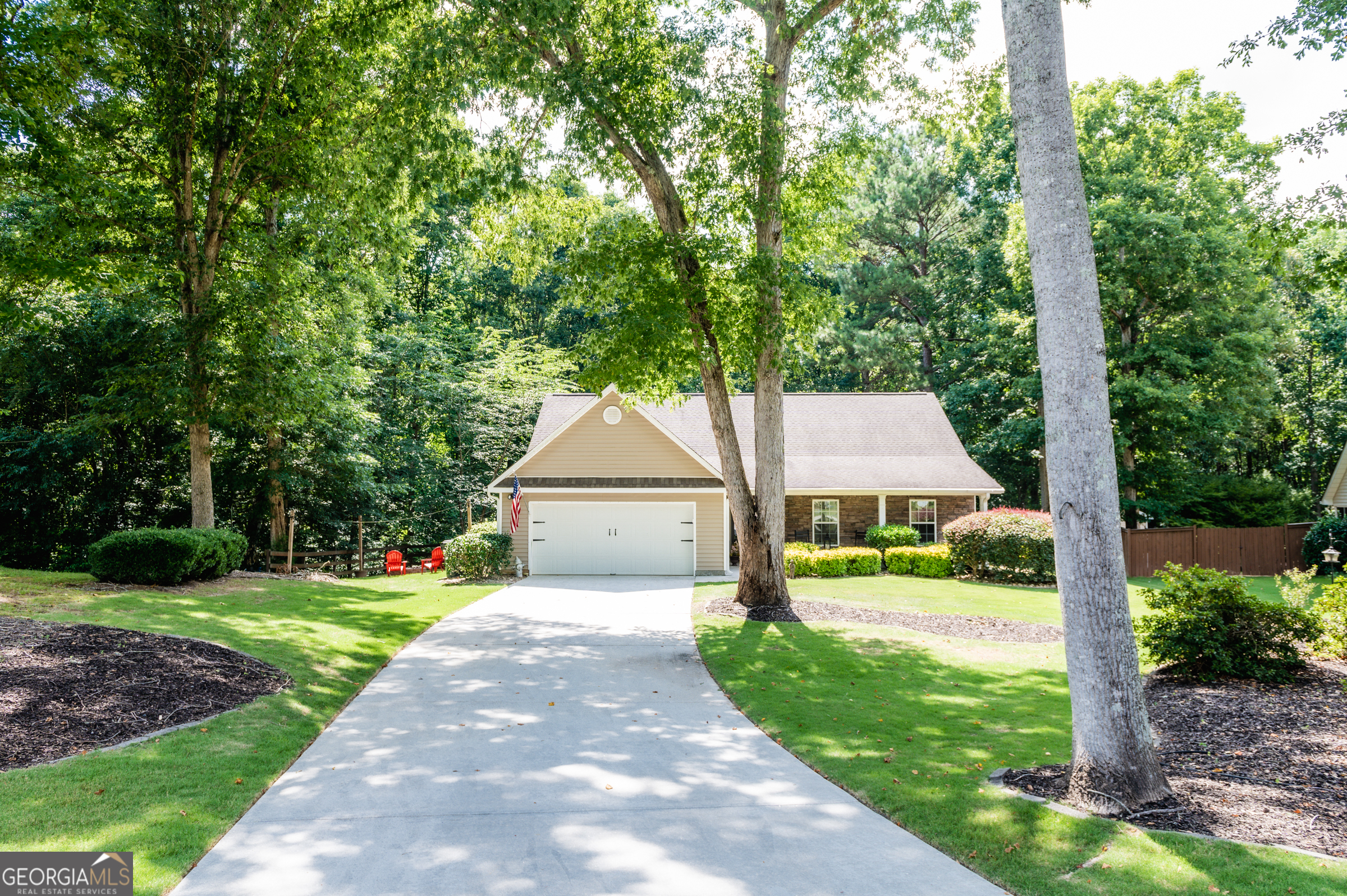 Welcome to this beautiful 3-bedroom, 2-bath ranch home nestled in a tranquil cul-de-sac within the sought-after Brookstone subdivision in Loganville. Zoned for the esteemed Walnut Grove High School, this property exudes pride of ownership, evidenced by the sellers' "Yard of the Month" award. Step inside to find updated flooring throughout and a fully renovated master bathroom. The kitchen and master bath boast elegant granite countertops, adding a touch of luxury. Enjoy your mornings in the cozy sunroom featuring stunning pinewood ceilings. The outdoor space is perfect for entertaining, with a side yard complete with a fire pit and string lights, creating a magical evening ambiance. The well-landscaped yard includes a storage shed for all your gardening tools. Additional features include a 2-car garage with built-in shelving and a community playground, making it ideal for families. Conveniently located just 10 minutes from shopping, this home offers both comfort and convenience. Don't miss the opportunity to make this lovely home your own!