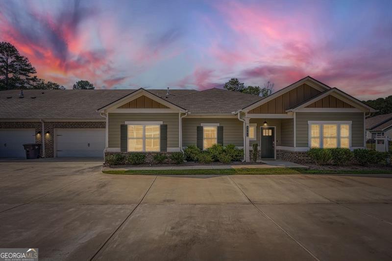 Welcome to easy living in Creekwood's premier 55+ gated community! This ranch-style townhome offers true one-level living with an open-concept design perfect for both everyday comfort and entertaining. The modern kitchen shines with a large island, granite countertops, stainless appliances, and a walk-in pantry. With 3 bedrooms and 2 full baths, this home offers flexibility-perfect for overnight guests, a dedicated hobby room, or a private home office. The primary suite is a true retreat, boasting beautiful tray ceilings, a generous walk-in closet, and a spa-like bath featuring dual vanities, a private water closet, and a step-less entry tile shower for comfort and ease. A two-car garage adds convenience and extra storage, while the covered back patio is perfect for year-round outdoor enjoyment. Residents of Creekwood enjoy a vibrant, active lifestyle with community amenities including a clubhouse, dog park, sidewalks, street lights, and the peace of mind that comes with a secure gated entrance. Offering a low-maintenance lifestyle, this home is perfect for anyone looking to simplify without sacrificing space or style