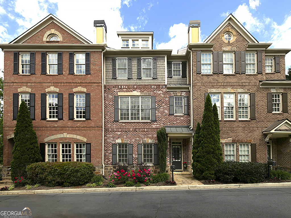 This beautifully maintained 3 bedroom, 3.5 bathroom townhome offers the perfect blend of comfort, convenience and modern upgrades. Located just moments from the vibrant Marietta Square and scenic Kennesaw Mountain, it's an ideal location for those seeking easy access to shopping, dining, and outdoor recreation. Cozy up by the fireplace in the great room with coffered ceiling and built in bookcases adjacent to the formal dining room with tray ceiling. The spacious kitchen offers granite countertops, microwave, stove, undermount lighting and large breakfast area-perfect for home cooks and entertainers alike. Step outside to a deck with a retractable awning, ideal for relaxing or entertaining guests. The owner's suite is a true retreat with separate sitting room, professional closet installation, and luxurious bath with quartz countertops. A second bedroom and full bath on the same level offers privacy and convenience for family or guests. The terrace level features a third bedroom or flexible space with adjacent tiled bath and access to large garage with professionally coated floor and large storage room. The HOA covers roof and gutter replacement, exterior painting, landscaping, termite control and water-making homeownership a breeze, Bonus! Seller will contribute $5000 toward buyer's closing costs with an acceptable offer. Don't miss out on this rare opportunity to live in one of Marietta's most desirable locations!