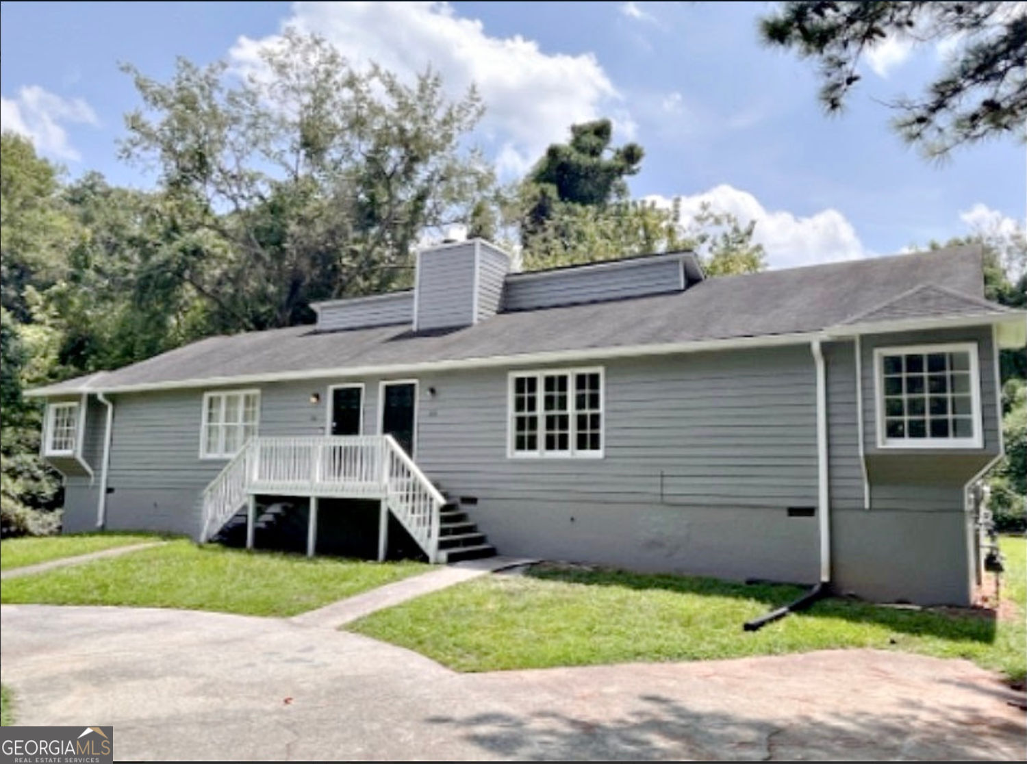 Rare Turnkey Duplex Just Minutes From Historic Marietta Square. Each side of this fully renovated duplex is tenant-occupied and features 2 bedrooms and 2 full bathrooms, living room with vaulted ceiling and decorative fireplace, updated kitchen with granite countertops and stainless steel appliances, LVP flooring throughout, washer/dryer connections, tankless water heater, and a private back deck with steps down to a huge fenced-in backyard. The property has been freshly painted inside and out, and sits on nearly an acre of land just 3 miles from the many shops, restaurants, and attractions at the Marietta Square. This versatile duplex is perfect for a first-time investor, a seasoned investor looking to grow an already successful portfolio, or a house hacker looking to occupy one side while renting out the other to offset the mortgage and expenses. The full list of updates to the property are detailed in the documents section. Turnkey investment opportunities this close to the Square are rarely available - don't miss it.