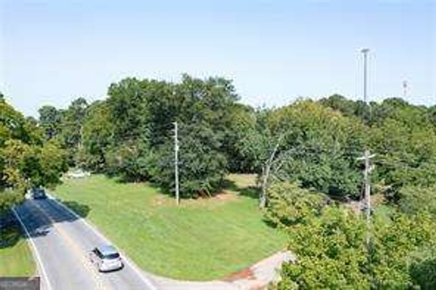 Wonderful 10.23 acres, only a few miles from Canton Market Place and Northside Cherokee.  Plenty of room for horses or livestock.  Build your dream home or family compound.  Property could be potential commercial as well.  Mostly fenced with large shop/barn for storage.