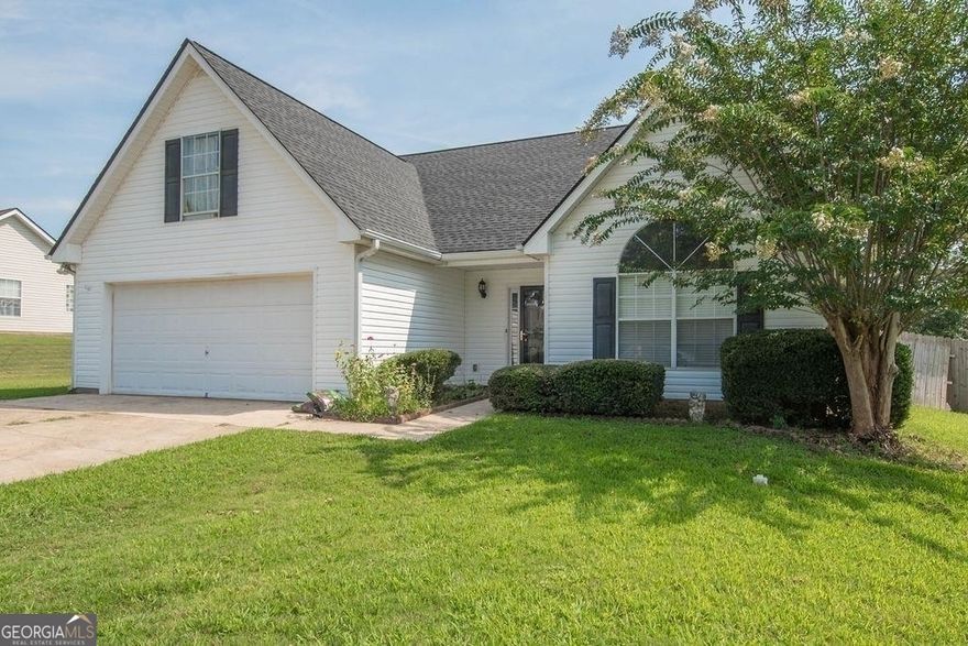 WELCOME HOME!!! Location, location, location!!! Just minutes from interstate 85, this charming home features 4 bedrooms, 2 baths, a large open living room with amazing high ceilings, a fireplace and so much more!!! The kitchen has beautiful tile backsplash, stainless steel appliances and there's a little breakfast area. Oversized master with tray ceilings, master bath features a double vanity, soaking tub and separate shower. There is so much space in this home you just have to see it, the 2-car garage has additional storage space as well. New roof with a 5-year labor warranty which is transferrable to the new owner. New hot water heater installed 3/23/2024. If privacy is important to you, the entire backyard is enclosed with a wooden privacy fence with lots of space for entertaining. Please let me know if you would like to schedule an appointment to tour this home! Sheri 678-416-9718