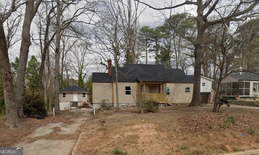 Gutted, shined up and ready for your finishing touches. This property has a new roof, all new siding and is framed out. Detached garage in rear of home that could double as an AirBNB income or secondary guest home.