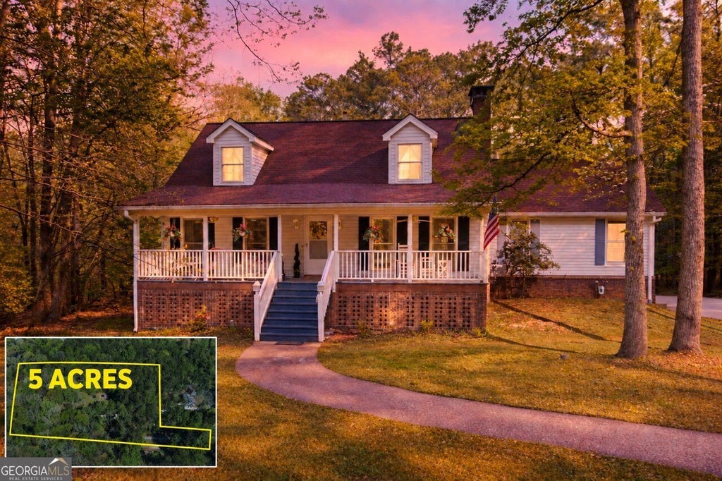 Photo of 5275 Sugar Ridge Drive NE, Buford, GA 30518 (MLS # 10876430)