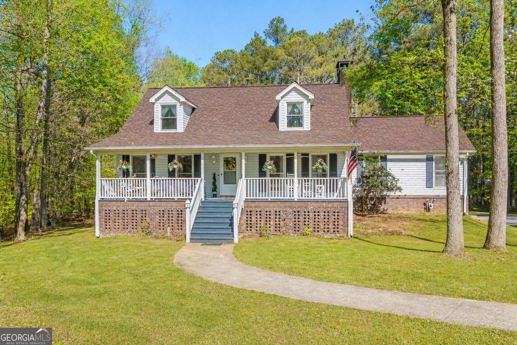 Photo of 5275 Sugar Ridge Drive NE, Buford, GA 30518 (MLS # 10876430)