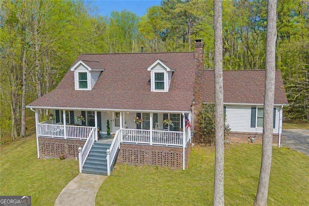 Photo of 5275 Sugar Ridge Drive NE, Buford, GA 30518 (MLS # 10876430)