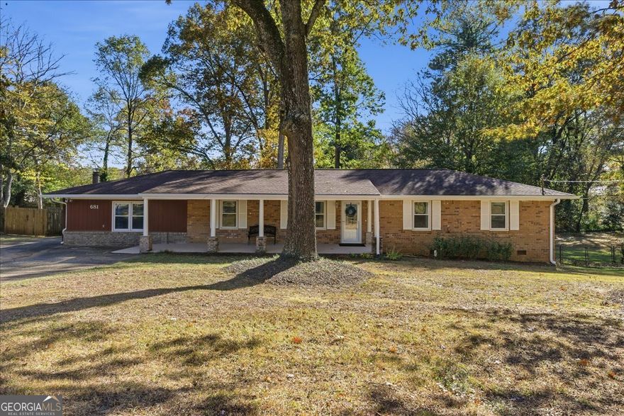 Welcome to this beautifully updated 4-bedroom, 3-bath brick ranch featuring a rare private in-law suite with its own entrance and an incredible 600 sq ft workshop/garage with electricity.  This timeless home has been thoughtfully renovated from top to bottom-kitchen, all three bathrooms, flooring, wiring/electrical, roof, deck, windows, interior and exterior paint, and more. Inside, you'll enjoy spacious living and dining areas and an inviting, easy flow throughout. The eat-in kitchen offers upgraded cabinetry, granite countertops, and stainless steel appliances. Hardwood floors shine throughout the home. One of the standout features is the private in-law suite, complete with its own bedroom/living area, full bath, walk-in closet, and a separate exterior entrance-perfect for multigenerational living or fantastic rental income potential. A generous 14x18 laundry room provides additional space that can easily accommodate a home office or hobby nook.  Step outside to the spacious backyard, where you'll love grilling and gathering on the deck. You'll also find an impressive 20x30 workshop/garage with 220-volt electricity-ideal for woodworking, car enthusiasts, or anyone needing dedicated creative or project space.  All of this is just minutes from shopping and dining and right by the entrance to the Silver Comet Trail, with an easy commute into Atlanta.  This special property truly has it all-and is one you won't want to miss!