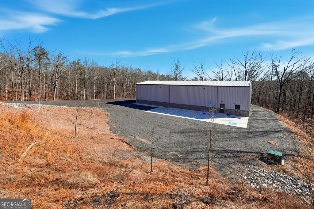 Photo of 610 Hogan Pond Ln, Ball Ground, GA 30107 (MLS # 10673732)