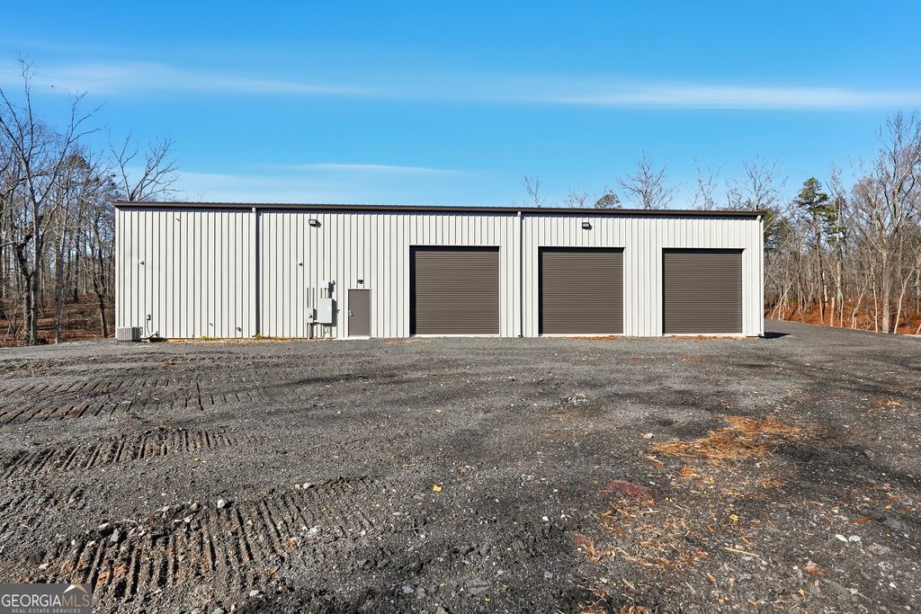 Photo of 610 Hogan Pond Ln, Ball Ground, GA 30107 (MLS # 10673732)