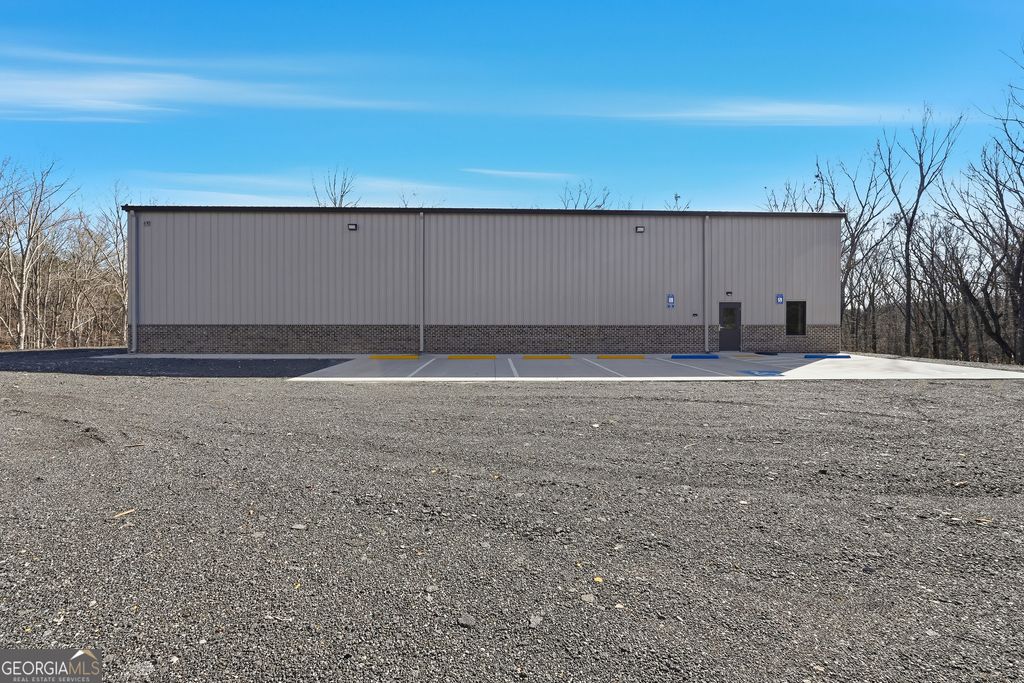 Photo of 610 Hogan Pond Ln, Ball Ground, GA 30107 (MLS # 10673732)