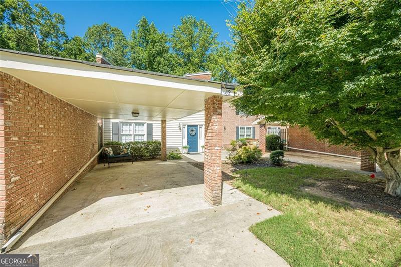 Welcome to your serene escape in the heart of Flowery Branch! Nestled in the sought-after lakeside community of Cinnamon Cove, this beautifully renovated 2 bedroom, 1.5 bathroom condo offers a rare blend of modern comfort and peaceful, wooded surroundings - just a short walk to the Lake Lanier waterfront. Step inside to find a tastefully updated interior featuring an open floor plan, stylish finishes, and plenty of natural light. The private balcony offers the perfect spot to unwind, surrounded by mature trees and nature views. This three-level home includes a spacious unfinished basement, providing ample storage space or the opportunity to create additional living areas. Sold fully furnished, this turnkey property is ideal as a weekend getaway, full-time residence, or investment opportunity. Enjoy lake life with nearby marinas, parks, and charming downtown Flowery Branch just minutes away.
