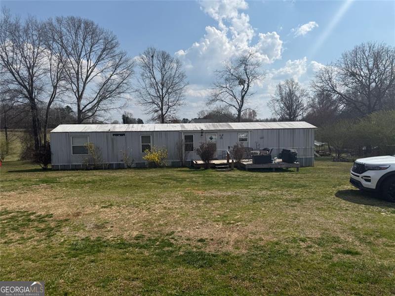 This unique property offers two mobile homes set on spacious acreage, making it ideal for a family homestead or investment opportunity. Enjoy the flexibility of multi-generational living, rental income potential, or simply extra space for guests.The land features a barn perfect for storage, animals, or hobby farming and a natural water spring at the back of the property, adding charm and sustainability. With plenty of open space, you'll have room for gardening, outdoor activities, or expanding your vision for country living.Don't miss out on this one-of-a-kind property with both income potential and natural beauty. Both tracks will be sold together.legal descriptions as follows 10-62 TRK 2 PB 53-26 58-293 DB 1206-245and 10-62 PB 53-26,58-294 DB 1206-245 PLEASE DO NOT DISTURB TENANTS. showings by appointment only.