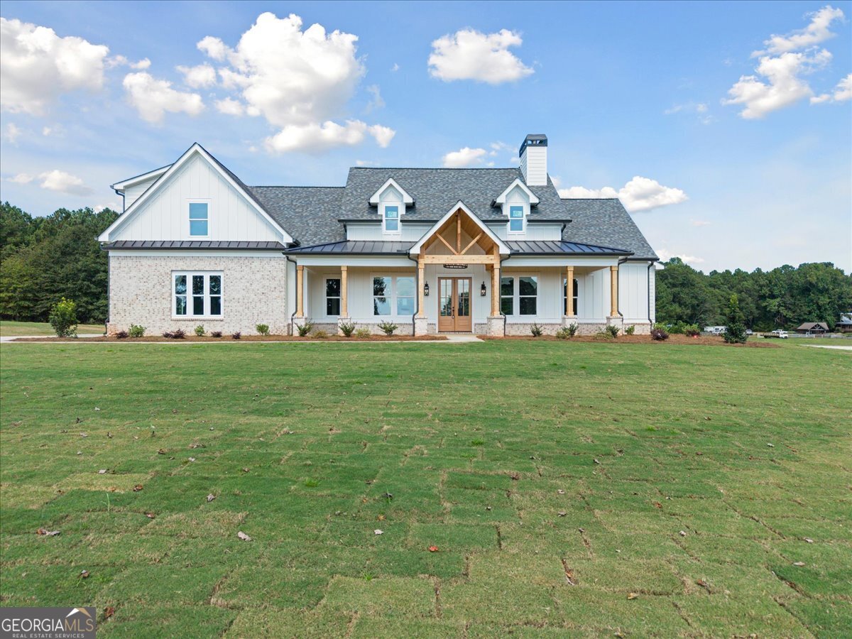 Step into this timeless beauty and explore all of the extras in this newly built home. This 4 bedroom/3/5 bath home is perfectly situated on 2.3 acres. An easy-living floor plan offers an open-concept family room, kitchen, and dining space, making this home perfect for family gatherings and entertaining. The spacious kitchen is complete with a cooktop, separate wall oven, built-in microwave, and a pot filler, making this an enjoyable space to prepare the perfect meals for family and friends. A nice oversized family area accented with a beamed ceiling and a gorgeous rock fireplace, awaiting those crisp fall evenings. The owner's suite is on the main level and offers a spacious area leading into a beautifully done bathroom with a standalone shower, double vanities, and a dreamy soaking tub. Two secondary bedrooms are found on the main floor, with a third secondary bedroom tucked away upstairs with its own bath, perfect for an office area or teen suite! Step outside to a gorgeous lawn and a blank canvas ready for your outdoor living design! Create a fire-pit area or build that pool you have been dreaming of! This property perfectly blends a bit of rustic elegance and charm to create a wonderful place to call home! Located conveniently to Madison, Watkinsville, Monroe, and Athens! Agents, please use the Contract Package found in the Doc Box. This sensational property will not last long!