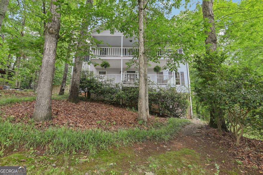 Desirable 4-Bedroom Traditional home in Sought-After East Cobb!  Welcome to your perfect family home nestled in a quiet cul-de-sac in the heart of the very desirable area of East Cobb. This beautiful 2-story home offers 4 spacious bedrooms and 2.5 baths, blending classic charm with comfortable living.  Step inside to find a warm and inviting layout. The large family room has a hilltop view of the neighborhood and a beautiful fireplace. Also, on the main floor is a spacious kitchen, breakfast area, large dining room overlooking the rocking chair front porch and an office or multi-purpose room. Upstairs you will find a very large primary bedroom suite that has a cozy gas fireplace -a true retreat that also boasts it's own private balcony, perfect for morning coffee or evening relaxation. The en-suite bath provides a peaceful haven after a long day.  You'll love the screened back porch overlooking a spacious, private fenced yard-ideal for play, entertaining, or simply unwinding in your own slice of nature. Whether you're hosting a summer cookout or enjoying a quiet evening outdoors, this space is sure to be a favorite. The home boasts a 2 year old roof, newer dual zoned HVAC with two air handlers, Hardi Plank siding with extra insulation, granite countertops, surge protection in the electrical box, radiant thermal insulation in the attic, wood molding, gutter guards and so much more. You won't even miss a beat whether working, gaming, or surfing because this home is wired throughout for internet.   Situated in a tranquil cul-de-sac with minimal traffic, this home offers both privacy and a strong sense of community. With great schools, shopping, parks, and dining just minutes away, this East Cobb gem is ready for you to make it your own.  HOA has minimal regulations and maintains the pool, tennis courts, and sponsors community social events.   Don't miss this opportunity to own the perfect family home in an unbeatable location!