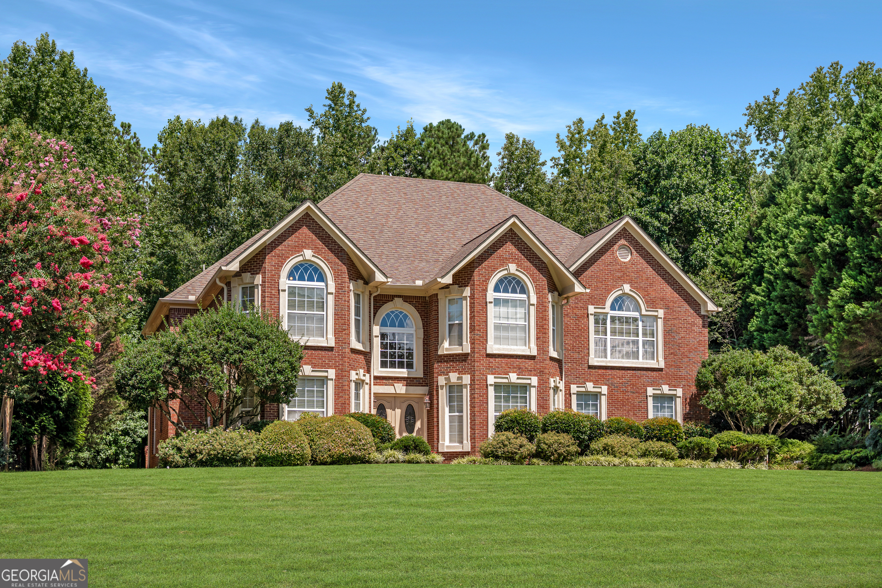 4 Sided brick gem with rare Dual Primary Suite Home in highly sought after neighborhood! They just don't make them like this anymore!! Step inside your new home...you'll be welcomed by soaring ceilings in the foyer and family room that fill the space with natural light. The chef's kitchen is a standout feature with luxury KitchenAid appliances, a prep sink, expansive countertops, and ample seating-perfect for both everyday living and entertaining. One of the home's most unique features is its two full primary suites, including one on the main level-ideal for multigenerational living or long-term guests, which has a cozy sitting area complete with a fireplace. Upstairs, you'll find the second Primary suite adjoined with a spacious bathroom. Down the hallway you will find three additional spacious bedrooms and a thoughtful layout designed for comfort and privacy. Recent updates include:Fresh interior paint (2024), Both HVAC units under two years old, Epoxy-coated garage floors, and a spacious, private lot with room for a pool! Your new home is in a well-maintained neighborhood with an OPTIONAL HOA!! This immaculate home is move-in ready and priced for a quick sale. There has only been one owner, and this home is very well taken care of! Don't miss your opportunity-schedule your showing today! Apply with Preferred lender Myron Fears (Umortgage) for a lender credit of up to 1%. No blind offers or creative financing per seller's request.