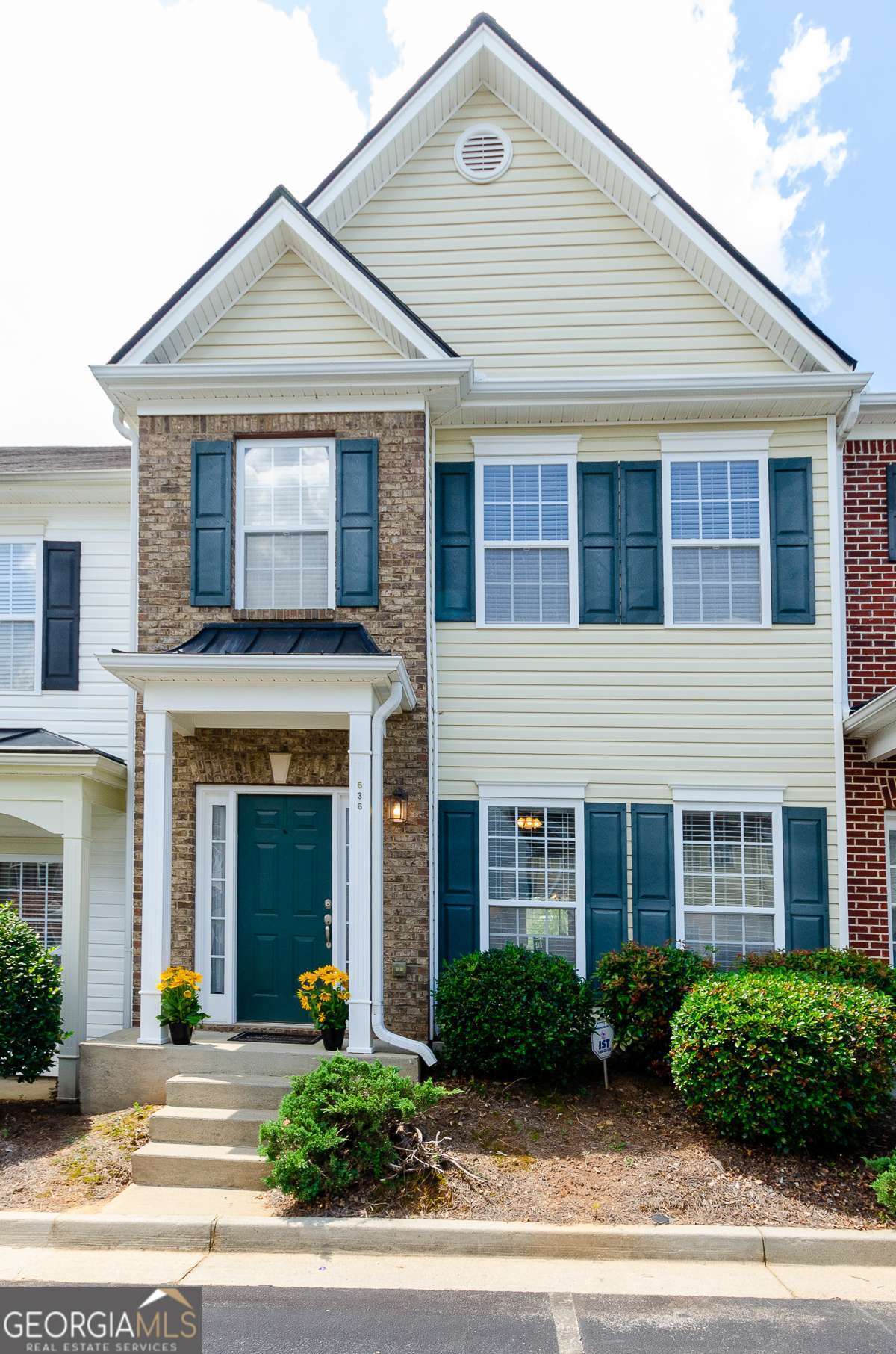 MOVE-IN READY AND APPLIANCES INCLUDED: BUILT-IN MICROWAVE, GAS STOVE, REFRIGERATOR, WASHER AND DRYER!! Beautifully maintained townhome located in sought-after Gwinnett County with quick access to I-85 and just minutes from Suwanee Town Center Park, shopping, dining, and Lake Lanier. Situated within the desirable Collins Hill School Cluster, this home offers a spacious open-concept layout with 9-foot ceilings and a bright kitchen that overlooks the cozy family room featuring a gas fireplace. Enjoy outdoor living with a private rear patio and a low-maintenance backyard. The upper level features a convenient roommate floor plan with two generously sized bedrooms, each with double closets and en-suite baths. A laundry area is thoughtfully located upstairs for added convenience. Exterior is clad in durable vinyl siding, and the HOA takes care of termite protection, water, trash service, and landscaping, making for hassle-free living. Additional highlights include recent HVAC system and roof upgrades - full of value, DON'T MISS THIS OPPORTUNITY!