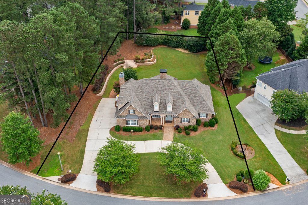 The Overlook at Summergrove is a highly sought-after area within this amenity-rich community. Open House Sunday 1:00-3:00. This stunning 3,400 sq. ft. home has everything you need! It features a side entry, a long driveway, an additional parking pad, and a circular driveway, providing ample parking space. The vaulted living room, dining room, and sunroom all offer beautiful views of the private backyard. The spacious kitchen is equipped with plenty of cabinets, an island with a bar, and a cozy sitting area complete with a fireplace. The main bedroom includes two walk-in closets and a fully renovated primary bathroom. Upstairs, you'll find a huge bonus room that can also function as a fourth bedroom, complete with a full bathroom, several walk-in closets, and a separate office space. The roof will be replaced in 2023. Summergrove is renowned for its resort-style amenities, including three pools, a lazy river, a zero-entry pool, and a purpose-built ball field. The central amenity features a community clubhouse, the largest pool, eight lighted tennis and pickleball courts, an ALTA tennis team, an 18-hole golf course, numerous parks and playgrounds, a beach volleyball court, and a 100-acre lake for fishing and boating. There's also an extensive network of sidewalks and The LINC. A walk-through video is available upon request.