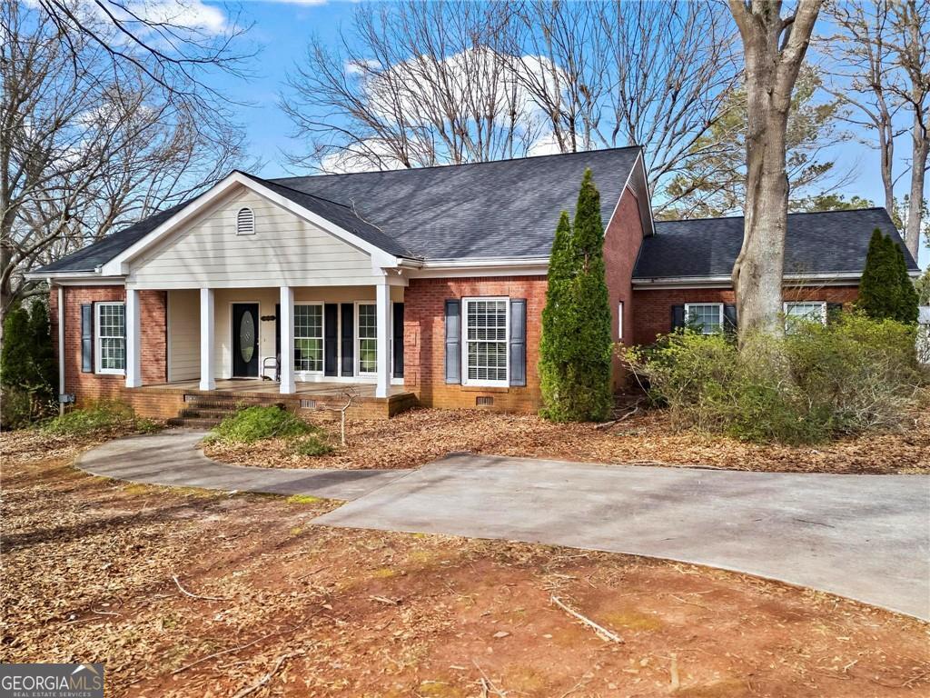 Live Your Country Dream- Minutes from Milton Discover this all- brick ranch-style home on 1.253 with no HOA. Whether you envision chickens in the yard or dogs running around, this property delivers. Inside, enjoy a spacious, light-filled layout with a large kitchen and breakfast nook, formal dining area, cozy family room with fireplace, and a flexible sitting room ideal for an office or reading retreat. The primary suite is tucked away for privacy. A full basement is ready to become your gym, media room, or guest suite, and a newer roof ensures peace of mind for years to come. Mature landscaping offers privacy, and the lot is level perfect for a pool. Best of all, you can walk your children to Summit Hill Elementary and enjoy top-ranked schools just moments away. This is country living with city access----come make it yours.