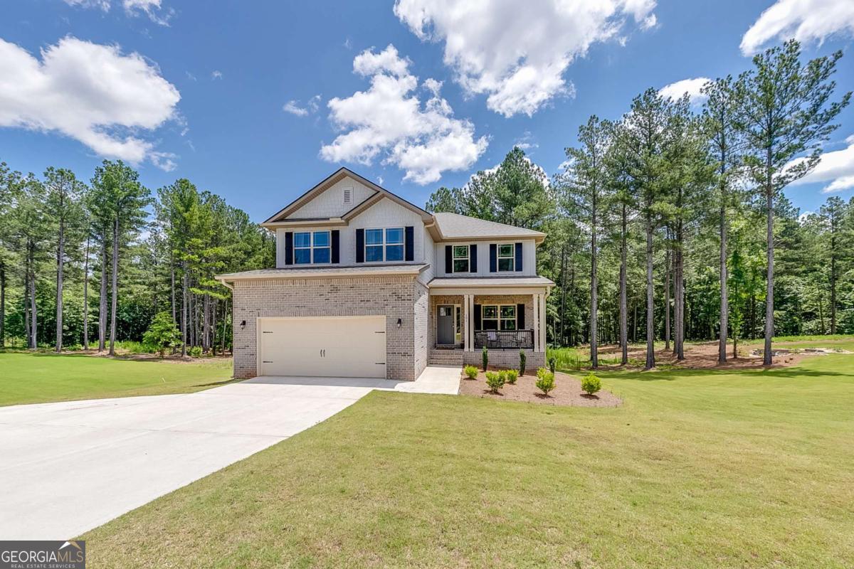 Prepare to fall in love with this stunning 6-bedroom, bonus room, 4.5-bath home plus a large flex room , perfectly situated on a gorgeous 1.58-acre homesite! Featuring a finished basement and a thoughtfully designed layout with the owner's suite on the main level, this home offers both luxury and functionality. Step inside to find upgraded LVP flooring throughout most common areas and bathrooms, adding style and durability. The open kitchen is a true dream, boasting upgraded white cabinetry, granite countertops, a huge center island, stainless steel appliances, and a seamless flow into the family room. The family room features a stunning fireplace and a large, expansive deck just beyond-perfect for entertaining or relaxing. The main-level owner's suite is a peaceful retreat with a spacious en-suite bath that includes quartz countertops, double vanities, a soaking tub, a separate tiled shower, and a generous walk-in closet. A formal dining room completes the main level, perfect for hosting gatherings. Wrought iron handrails lead you upstairs to four oversized bedrooms, two full bathrooms, and a gigantic bonus room, along with a convenient upstairs laundry room. The fully finished basement offers even more living space with an additional bedroom, full bath, and an oversized recreation/flex room-ideal for a home theater, game room, or multi-generational living. This home is packed with premium upgrades throughout, including quartz countertops in all bathrooms, making it move-in ready and designed to impress. Home comes with a transferrable warranty, 2 year systems warranty, 10 year structural warranty