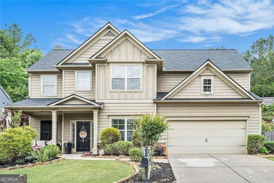 SELLER WILL PROVIDE A HOME WARRANTY WITH 2-10 Home Buyers Warranty Company. Your Dream Home in Woodstock Awaits! Welcome to this charming Craftsman-style home nestled on a quiet cul-de-sac just minutes from vibrant Downtown Woodstock. This beautifully maintained 5-bedroom, 3-full-bathroom residence offers the perfect blend of comfort, functionality, and elegance-ideal for families and entertainers alike. 1. Versatile main-level bedroom or flex space - perfect for a guest suite, office, or playroom. 2. Gourmet kitchen featuring a large island with built-in sink and dishwasher, breakfast area, gas range, and open-concept flow into the fireside family room. 3. Stylish upgrades throughout: hardwood floors on the main level, a formal dining room with crown molding and picture frame detailing. 4. Spacious upper-level layout with a primary suite and a secondary bedroom with direct access to a full bathroom. 5. Two-car garage with built-in shelving and pegboard for organized storage. 6. Professionally landscaped backyard with an expansive covered patio-perfect for outdoor dining and entertaining year-round. Enjoy the best of both worlds: the peace and privacy of a tucked-away neighborhood, just minutes from Woodstock's restaurants, shops, parks, and entertainment. Prime location + thoughtful layout + timeless finishes = your perfect forever home. Schedule your private tour today-this gem won't last long!