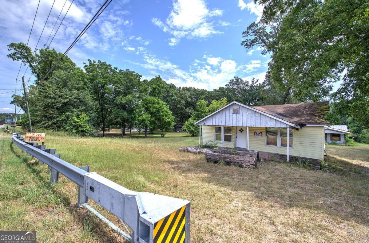 Prime commercial land located directly on Highway 411 with high visibility and heavy passing traffic, ideal for a wide range of business opportunities. Zoned commercial this prime 0.80-acre lot is located just 1.4 miles from I-75 Exit 290 in Cartersville, GA. This highly visible property sits along Highway 411 and is ideally positioned near major attractions including the Tellus Science Museum, Savoy Automobile Museum, and within minutes from LakePoint Sports Complex. Surrounded by established businesses and offering excellent access to I-75, this site is well-suited for retail, office, or service-oriented development in a rapidly growing commercial area.