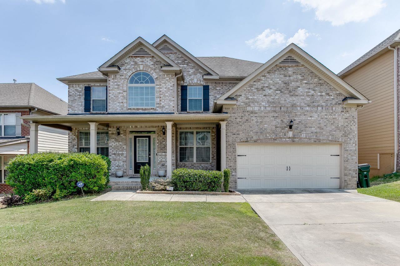 Beautiful three story home with an inviting front entrance. Elegant sitting room & dinning area with vaulted ceilings. The eat in kitchen is fully equipped with granite counter tops and stainless steel appliances, it is open to the family room with a brick fire place. Spacious rooms. The Master bedroom includes a lovely sitting area with yet another fire place and the master bathroom showcases a his and her vanity, a stone walk-in glass shower, and a sit in tub. The basement is framed out and ready to be finished by a crafty owner. Schedule your showings today!