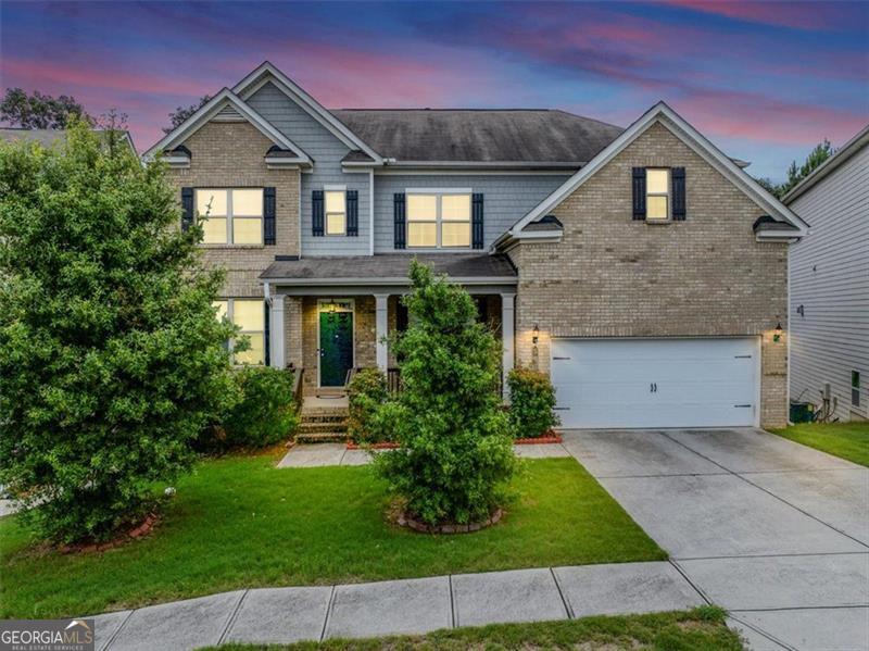 Beautiful Executive Two Story Brick Front Traditional Home! Bedroom on the Main floor with Full Bath. Two Story Family Room with Wall of Windows! Open Concept Floorplan. Kitchen with Huge Island that Opens to the Family Room. Elegant Formal Living and Formal Dining Rooms. Oversized Master Suite Upstairs with Spa Like Bath. Dual vanities, soaking tub, separate shower, large walk-in closet. Two spacious guest bedrooms with Jack and Jill bath. One private on-suite bedroom. Laundry Room upstairs and right outside the master bedroom. Hardwood floors on the main floor living areas. Soaring ceilings and open and bright floorplan! Unfinished basement just waiting for your expansion. This home has so much to offer. Beautifully appointed and well taken care of by the original owners. Don't miss this beautiful property! Make it your forever home.