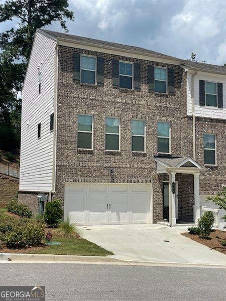Stunning, like new, three story end-unit townhome in the new community of Hamlin Grove. Private end-unit with view of landscaped hillside. Lower level includes a two car garage, main entrance to unit and a guest/home office with private bath. The beautiful main level boasts a gorgeous kitchen with white cabinetry and SS appliances. Room for kitchen table or just additional open space. Family room includes two additional windows flanking the amazing fireplace with new TV mounted over the mantle. Half bath on main level. Upstairs boasts an oversized primary suite with tray ceiling and a beautiful view of the private back area of the property. Spacious ensuite and closet space. A hall laundry closet with washer and dryer between the primary suite and secondary guest room. Enjoy the private back area of the property on the secluded back deck.
