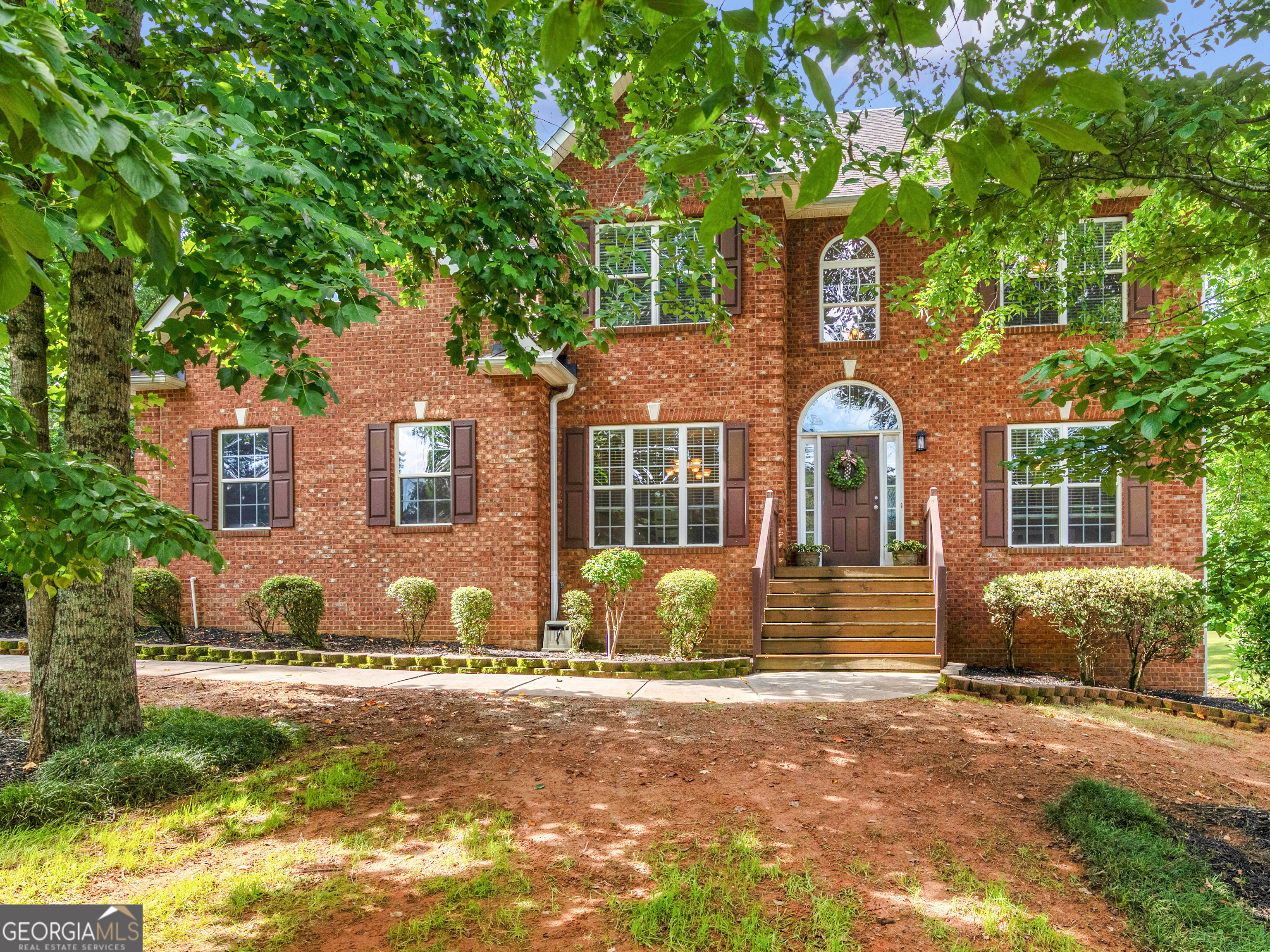 Welcome to your dream home! This stunning 4-bedroom 2 1/2 bath home, offers timeless curb appeal and versatile living space, nestled in a peaceful, well-maintained neighborhood. This beautiful home sits on a 1-acre lot and has a 2-car garage with an extra parking pad. As you step through the front door, you're greeted by a grand foyer with soaring ceilings and natural light! Just off the entry, a flexible recreation room or home office provides the perfect space for work, play, or relaxation. Continue to the formal dining room and then into the living room to unwind, complete with a cozy fireplace. The kitchen offers granite countertops, plenty of cabinets , stainless-steel appliances, and an eat-in kitchen nestled beside a picturesque bay window overlooking the serene back yard, which has an in ground full lawn irrigation system already in place. As you walk upstairs, you will step inside the expansive Primary Suite that offers a peaceful retreat, along with a sitting room that offers a quiet area with a window allowing the natural light to softly flow in, highlighting its relaxing charm. His and her walk-in closets are a plus, as well as an elegant en-suite bathroom with separate shower and a relaxing soaking jetted tub. Three additional, ample size bedrooms share a full bath, providing comfort and privacy for family or guests. There are beautiful hardwood floors throughout the main floor, ceramic tile and LVP in the bathrooms and laundry room, carpet in the bedrooms and hallway upstairs. The 1450 sq. ft. of unfinished walk out basement provides a great opportunity to customize and transform it into a recreational space, home gym, or additional living quarters! Convenient access to schools, shopping, and major highways. This home has been filled with love and everlasting memories, and now it's ready to welcome its new loving family! Seller is offering a 1 year home warranty!! Don't miss your chance to make this warm and welcoming house your forever home! Schedule your private tour today!