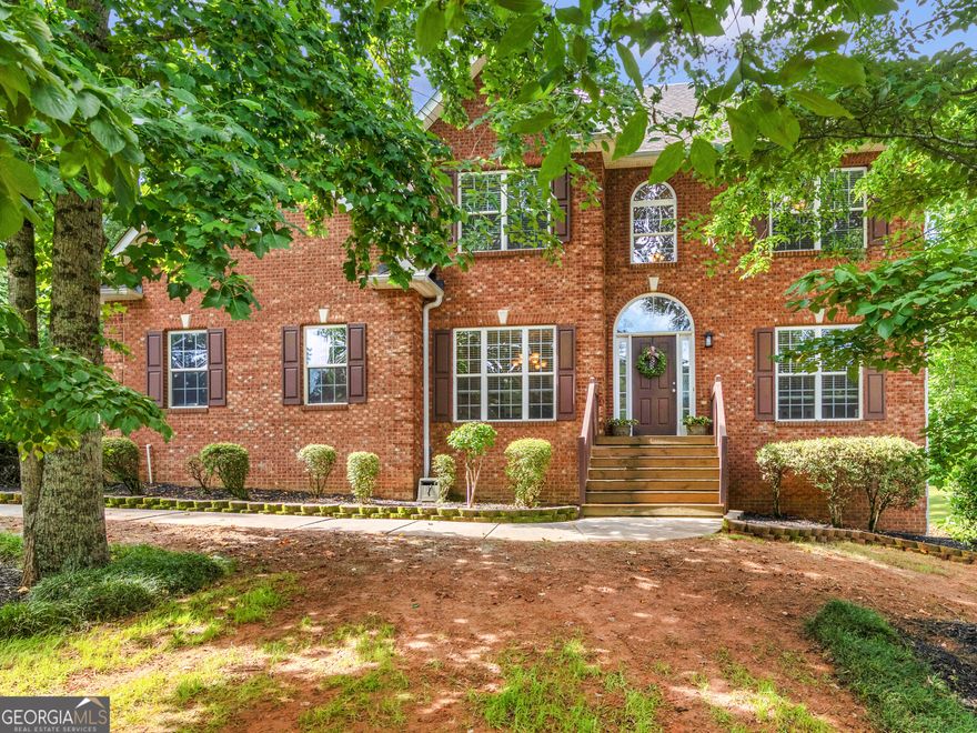 Welcome to your dream home! This stunning 4-bedroom 2 1/2 bath home, offers timeless curb appeal and versatile living space, nestled in a peaceful, well-maintained neighborhood. This beautiful home sits on a 1-acre lot and has a 2-car garage with an extra parking pad. As you step through the front door, you're greeted by a grand foyer with soaring ceilings and natural light! Just off the entry, a flexible recreation room or home office provides the perfect space for work, play, or relaxation. Continue to the formal dining room and then into the living room to unwind, complete with a cozy fireplace. The kitchen offers granite countertops, plenty of cabinets , stainless-steel appliances, and an eat-in kitchen nestled beside a picturesque bay window overlooking the serene back yard, which has an in ground full lawn irrigation system already in place. As you walk upstairs, you will step inside the expansive Primary Suite that offers a peaceful retreat, along with a sitting room that offers a quiet area with a window allowing the natural light to softly flow in, highlighting its relaxing charm. His and her walk-in closets are a plus, as well as an elegant en-suite bathroom with separate shower and a relaxing soaking jetted tub. Three additional, ample size bedrooms share a full bath, providing comfort and privacy for family or guests. There are beautiful hardwood floors throughout the main floor, ceramic tile and LVP in the bathrooms and laundry room, carpet in the bedrooms and hallway upstairs. The 1450 sq. ft. of unfinished walk out basement provides a great opportunity to customize and transform it into a recreational space, home gym, or additional living quarters! Convenient access to schools, shopping, and major highways. This home has been filled with love and everlasting memories, and now it's ready to welcome its new loving family! Seller is offering a 1 year home warranty!! Don't miss your chance to make this warm and welcoming house your forever home!  Schedule your private tour today!