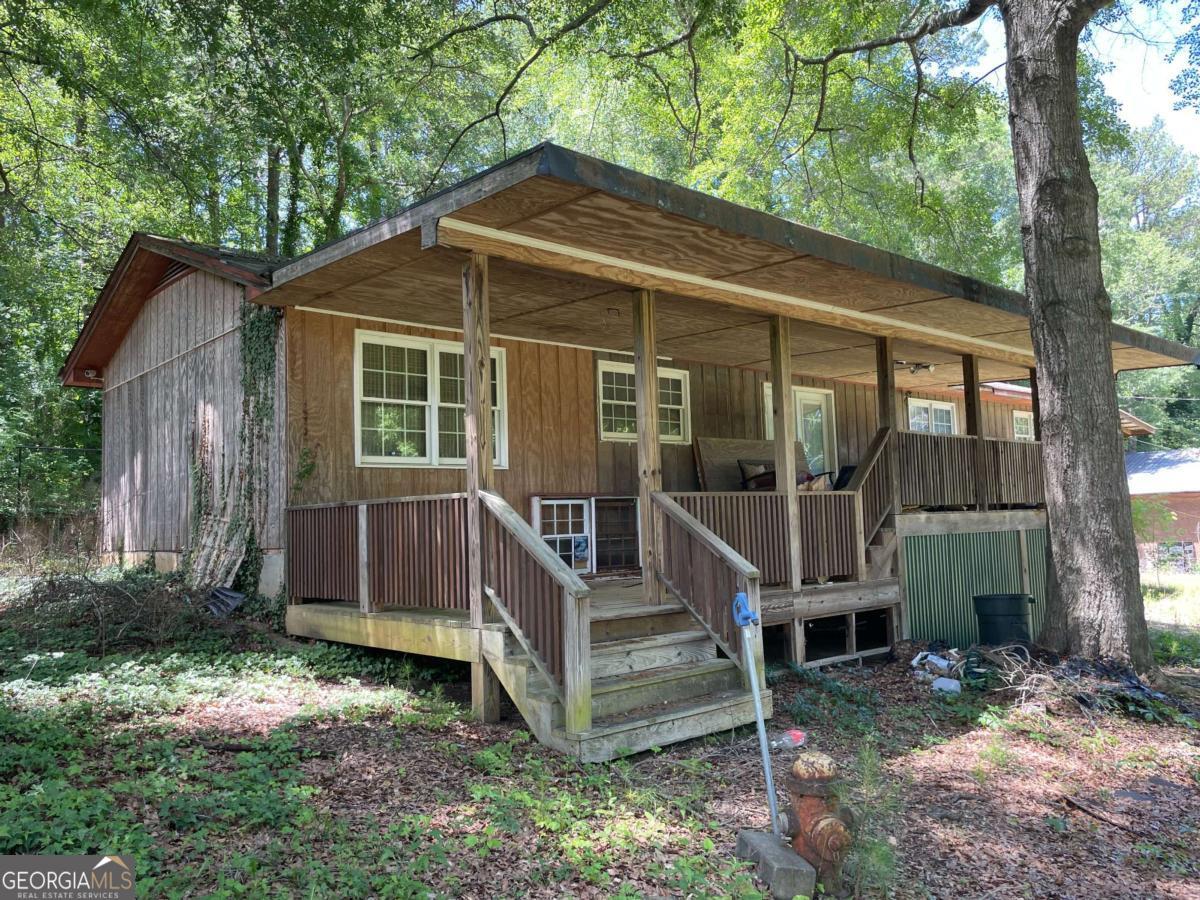 Mobile home with addition on over half an acre.