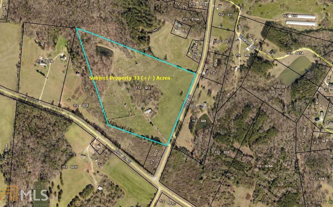 ONE OF THE LAST BEAUTIFUL LARGE TRACTS IN THIS AREA! LOCATED ON HWY 60 NEAR THE INTERSECTION WITH HWY 124. THE PROPERTY BOASTS A SMALL, SPRING FED POND ON 23 ACRES OF OPEN/PASTURE ACREAGE WITH 10 WOODED ACRES. THERE IS A SPLIT-LEVEL HOME CONSISTING OF 4 BEDROOMS AND 2 BATHS WHICH IS IN NEED OF REPAIR. IDEALLY SUITED FOR A GENTLEMAN'S FARM, RESIDENTIAL DEVELOPMENT, OR POTENTIAL COMMERCIAL. ALL UTILITIES ARE AVAILABLE. EASY ACCESS TO HOSCHTON, BRASELTON, GAINESVILLE, ATHENS, AND I-85! MUST SEE TO APPRECIATE THIS JEWEL!!