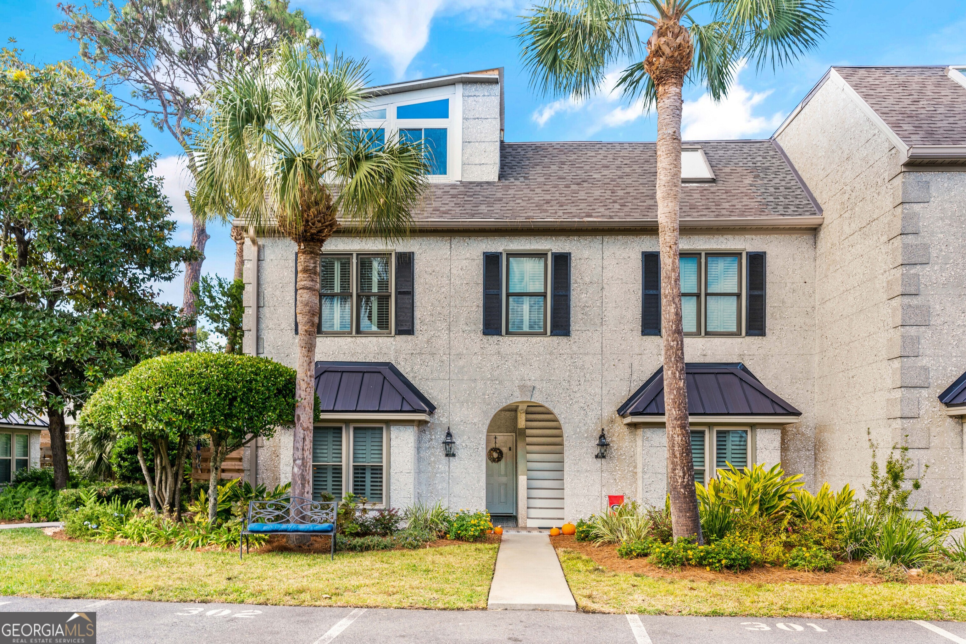 Location, location, location! Beachcomber condos are located just one-half block from the beach with easy access from the Second Street public beach crossover or from 1st Street. #201 is a single story ground floor end unit that has been meticulously maintained and recently renovated, including tongue & groove ceilings and high quality laminate flooring throughout. Updated kitchen offers plenty of cabinetry, stainless appliances, quartz countertops, and breakfast bar. Open concept kitchen/dining/living area. Built-in bookcases and wood burning fireplace in living room. Primary bedroom suite features two closets and a renovated bathroom with walk-in shower. Guest bath has also been fully renovated to include new tub and tile surround, new vanity and fixtures. HVAC and water heater are only a few years old. Plantation shutters. This is one of only a handful of units with a fully fenced outdoor patio. Being sold turnkey! Private owners closet inside and outside! Don't forget your beach cart so you can head right to the beach! You can't get any closer to the beach at this price. NO MINIMUM RENTAL RESTRICTIONS. On track to gross $70K this year! Sold turn key minus some artwork and personal belongings.