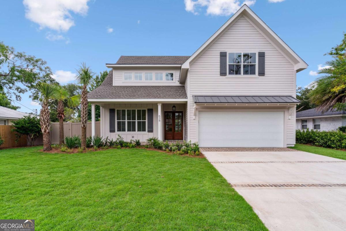 Coastal Luxury Living- Just a few blocks from the Beach on #saintsimonsisland Experience the best of island living in this brand-new, custom low country, 5-bedroom, 5.5-bathroom home, perfectly situated just a short distance from the beach and pier village area. Boasting 3,261 square feet of thoughtfully designed space, this coastal retreat offers both style and functionality with upscale finishes and high-end appliances throughout. Inside, the open-concept layout features a gourmet kitchen complete with a gas range, wall oven with built-in microwave, wine cooler, ice maker, and a top-of-the-line dishwasher with disposal. Dual laundry rooms-one upstairs and one down-each include a washer and dryer for added convenience. Elegant light fixtures and ceiling fans enhance every room with both beauty and comfort. Outdoors, enjoy entertaining with a built-in grill and a spacious patio perfect for coastal evenings. Whether you're seeking a primary residence, vacation getaway, or investment opportunity, this beautifully crafted home is island living at its finest. Not only steps away from the beach, but the new construction residence will sit on almost a 1/4 acre. Don't miss your chance to own a piece of paradise on Saint Simons Island! Plan available upon request and showings shall be accompanied by a Realtor. #SAINTSIMONSISLAND #NEWCONSTRUCTION #COASTALGEORGIA