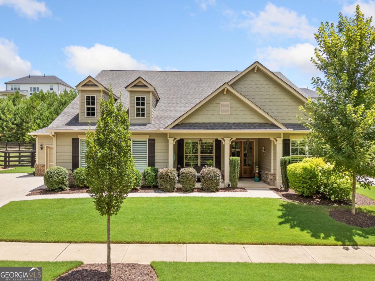 Stunning Ranch Home with Oversized Owner's Suite, Gorgeous Finishes & Incredible Storage! This beautifully maintained home offers the ideal layout with the primary suite and two guest bedrooms on the main level. The oversized owner's retreat features a private sitting area, a luxuriously updated bath with new quartz countertops, and a custom walk-in closet that's a dream come true. The two guest bedrooms share a Jack & Jill bath, perfect for family or visitors. A separate study/office, formal dining room, and a spacious family room with fireplace provide flexible living and entertaining space. The gourmet kitchen is the heart of the home with granite countertops, a large breakfast island, custom-built pantry, and a newer refrigerator and pull-out shelves in lower kitchen cabinets and double trash bin in cabinet. Step outside to enjoy the large covered front porch or relax on the expansive back patio equipped with remote-controlled patio screen, perfect for year-round enjoyment. Upstairs you'll find a 4th bedroom or bonus room with a full bath, ideal for a guest suite, hobby room, or teen space. Gorgeous hardwood floors flow throughout the main living areas, with tile in all bathrooms and carpet in the secondary bedrooms. Additional features include:3-car garage, Leaf gutter guards, New double glass front entry doors, Enormous walk-in attic storage, instant hot water with recirculating pump, whole house surge protector owned security system, Interior freshly painted (October 2024), Exterior painted approx. 18 months ago This home truly has it all - space, comfort, upgrades, and storage galore. Don't miss your opportunity to call it yours!