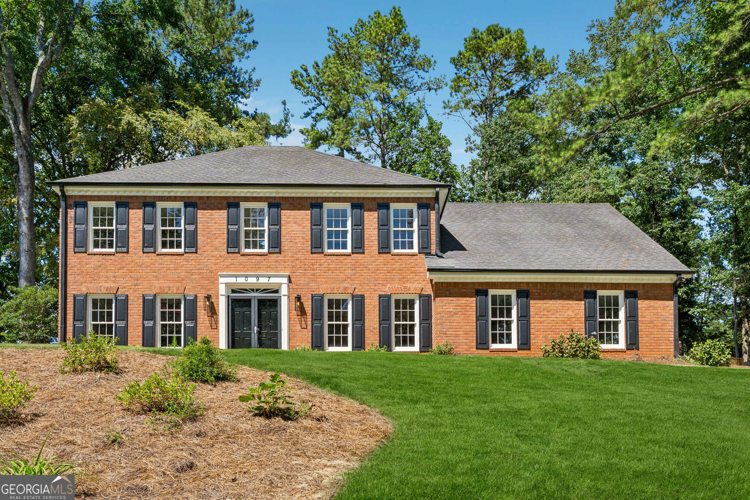 Welcome to this beautifully renovated brick-front home in Princeton Walk, one of East Cobb's most desirable and well-maintained communities. With only 130 homes, Princeton Walk offers a close-knit feel with swim and tennis amenities, all within the top-rated Mount Bethel, Dickerson, and Walton school district. Homes in this neighborhood very rarely come available. The main level features formal living and dining rooms, a spacious family room, and a light-filled sunroom with views of the backyard. The updated kitchen with vaulted eat-in area connects seamlessly to both the family and sunroom spaces. A laundry room with sink and convenient half bath complete the main level. Upstairs, the primary suite includes a private sitting room, bathroom with double vanities and walk-in shower, plus a generous walk-in closet. Three additional bedrooms share a guest bath with double sinks, while two staircases provide easy flow. Outside, enjoy a large, level backyard-perfect for entertaining, play, or future customization. With modern updates, classic features, and a fantastic location, this Princeton Walk home delivers the best of East Cobb living.