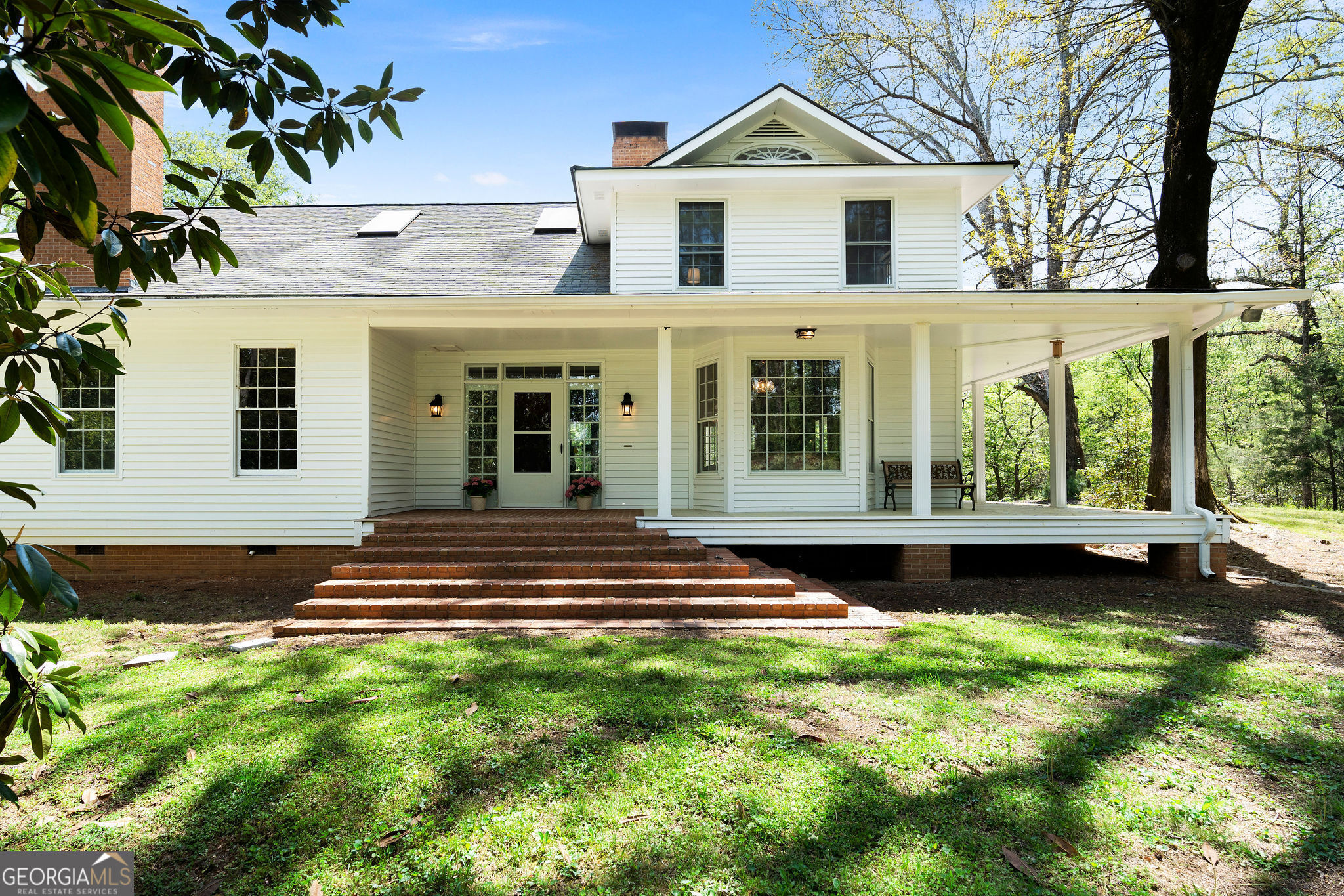 Nestled on more than 17 acres of land, this one of a kind property is ready to be yours! Throughout its interior, this captivating home has a welcoming atmosphere enhanced by charming pine wood finishes! With over 5,000 square feet of living space, the three spacious bedrooms offer comfort beyond compare, including a generously sized primary bedroom on the main level that ensures convenience and accessibility. Also the massive primary bathroom comes with its own jacuzzi! The Great Room is flooded with natural light, providing ample space for gatherings and relaxation. The kitchen, accessible from multiple points, has an inviting ambiance that welcomes all. Five cozy fireplaces throughout the home add a touch of warmth and character to the space. A wraparound porch offers the perfect spot to enjoy the tranquil views of your private sanctuary in every season. Beautiful magnolias and white oak trees are scattered throughout the 17 acres of land. The property also features a guest house awaiting your personal touch and renovations to make it your own. This one of a kind property presents an exceptional opportunity to embrace a lifestyle of comfort, serenity, and luxury!