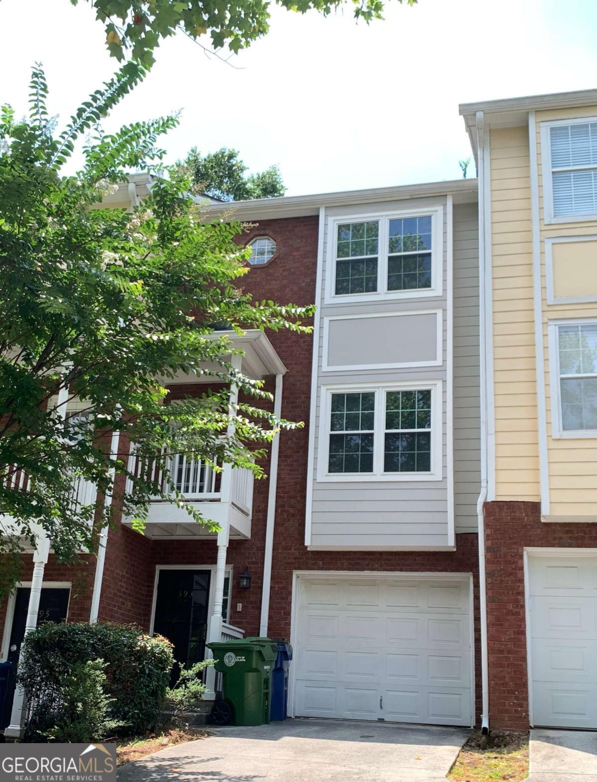 Welcome to this spacious 2 bedroom, 2.5 bath townhouse in Mechanicsville. RENT INCLUDES ALL UTILITIES, INTERNET, WATER AND GARBAGE. Traverse the stairs to the first floor to find the kitchen, dining room, half bath, family room with hardwood floors and a fireplace, and balconies on the front and back. The next level boasts 2 bedrooms with an ensuite bathroom for the perfect roommate situation. Enjoy parking in the driveway and the street. Conveniently close to highways 75/85 and I20, shops and restaurants in Summerhill, Grant Park and the Atlanta Zoo; and about a mile from the Beltline. Call for a viewing today!