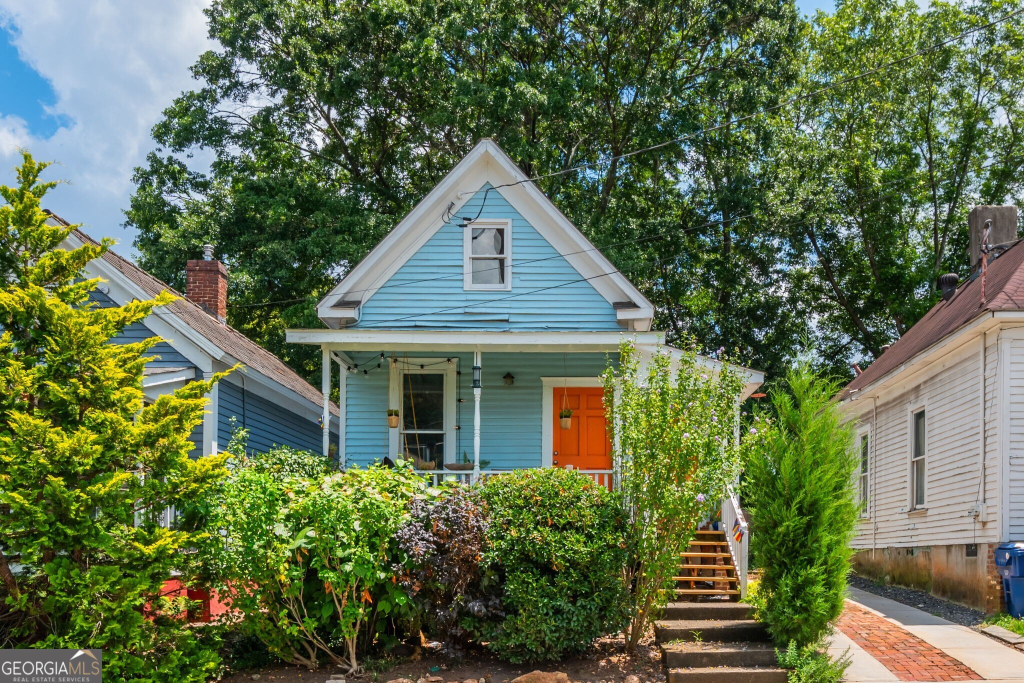 Charming 1920 bungalow in the heart of Cabbagetown. Live in a piece of history with this beautifully preserved and maintained 2 bedroom, 2 bathroom bungalow in the highly sought-after Cabbagetown neighborhood! Built in 1920, this home offers a perfect blend of historic charm and modern updates. Featuring original hardwood floors, exposed brick and high ceilings, the open concept living and dining area is warm and inviting. The updated kitchen includes all modern appliances, ample cabinet space, and a breakfast bar. The primary suite downstairs boasts a private bath and generous closet space, while the second bedroom upstairs is perfect for a guest room, home office or roommate setup. Step outside to enjoy a charming front porch and a private backyard, perfect for relaxing or entertaining. Conveniently located by the shops and restaurants on Carroll St, the BeltLine, Krog Street Market, and Cabbagetown Park, this home offers easy access to some of Atlanta's best dining, shopping and entertainment.