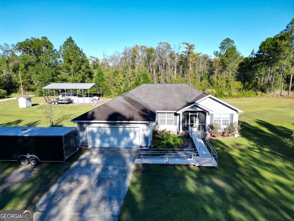 Photo of 164 Leonard Hughes Road SW, Ludowici, GA 31316 (MLS # 10876687)