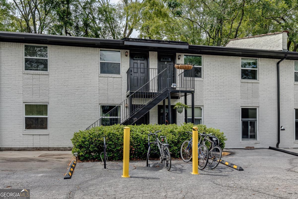 Welcome to easy, intown living in one of Atlanta's most beloved neighborhoods. Check out this charming, move-in ready condo in the heart of Grant Park. This freshly painted cutie is located on the top floor in a quiet 15 unit community just blocks from The Beltline, Grant Park, Zoo Atlanta, Oakland Cemetery, and some of the city's most delightful gems (I mean, have you tried Little Tart After Dark? It's DELICIOUS!), the weekend farmers market, Birdcage, and Cabbagetown are all just a short stroll away. Inside, enjoy hardwood and tile floors throughout, an updated kitchen with granite countertops and stainless steel appliances, and a modern bath. The open living and dining areas create a comfortable flow, and your private back door opens to a shared green space and dog run. Washer, dryer, and refrigerator all stay, making this one truly move-in ready. Off-street parking for you and your guests, easy access to MARTA and the interstate, and a close-knit community feel make this an ideal home base for enjoying all that intown Atlanta has to offer. This is a rare opportunity for affordable city living in a walkable, vibrant neighborhood. Come make yourself at home.