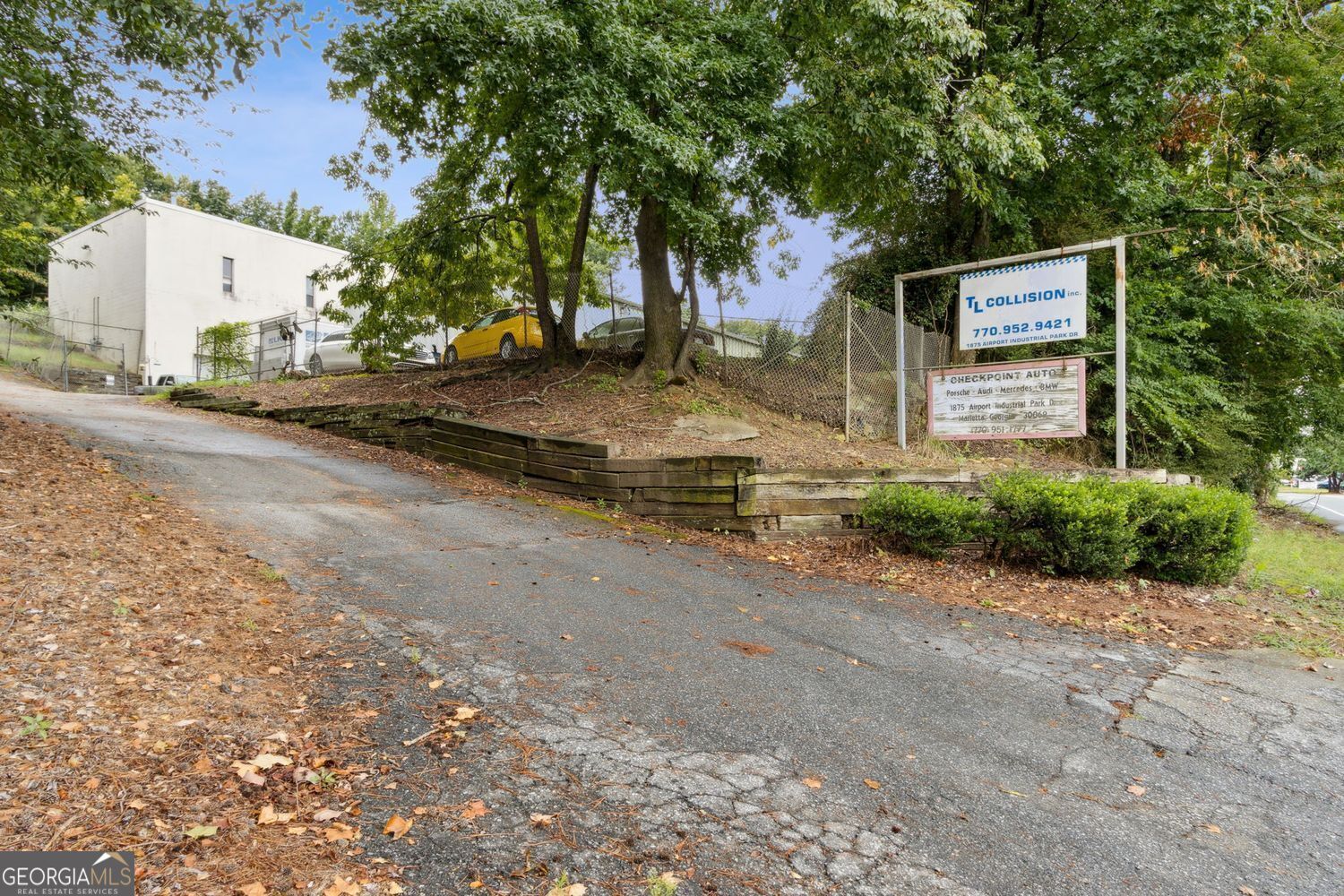 This 13,330 SF industrial property on 1.26 acres is located in Marietta's established industrial corridor with quick access to I-75, I-285, and US-41. The two versatile buildings are divided into three units, all fully occupied, yet leased at below-market rental rates-providing immediate income and strong upside potential for investors seeking solid ROI from day one. Features include high ceilings, concrete floors, and drive-in roll-up doors, ideal for light industrial, automotive, or service users. Current operations consist of an auto collision repair center with a paint booth and two spacious maintenance suites with vehicle lifts, supported by central HVAC, hanging gas furnaces, and radiant tube heating. The property also offers secure gated parking and ample surface spaces, making it especially attractive to contractors and small businesses needing indoor storage and fleet space. Its prime location, versatile design, and strong tenant base create a rare opportunity for investors, owner-operators, and growing businesses alike. Schedule a tour today to capture the upside.